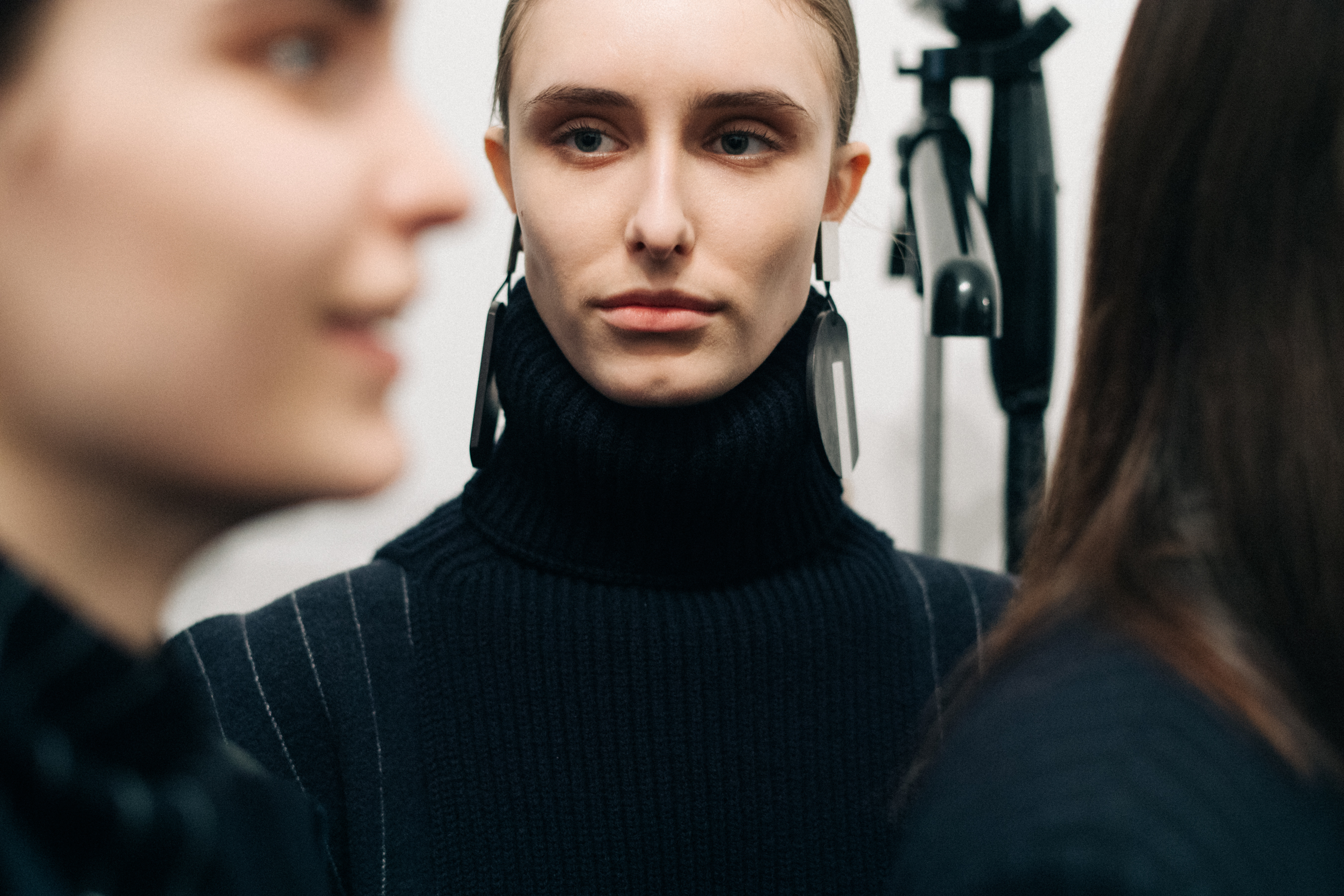 Model wearing a black Nehera turtleneck