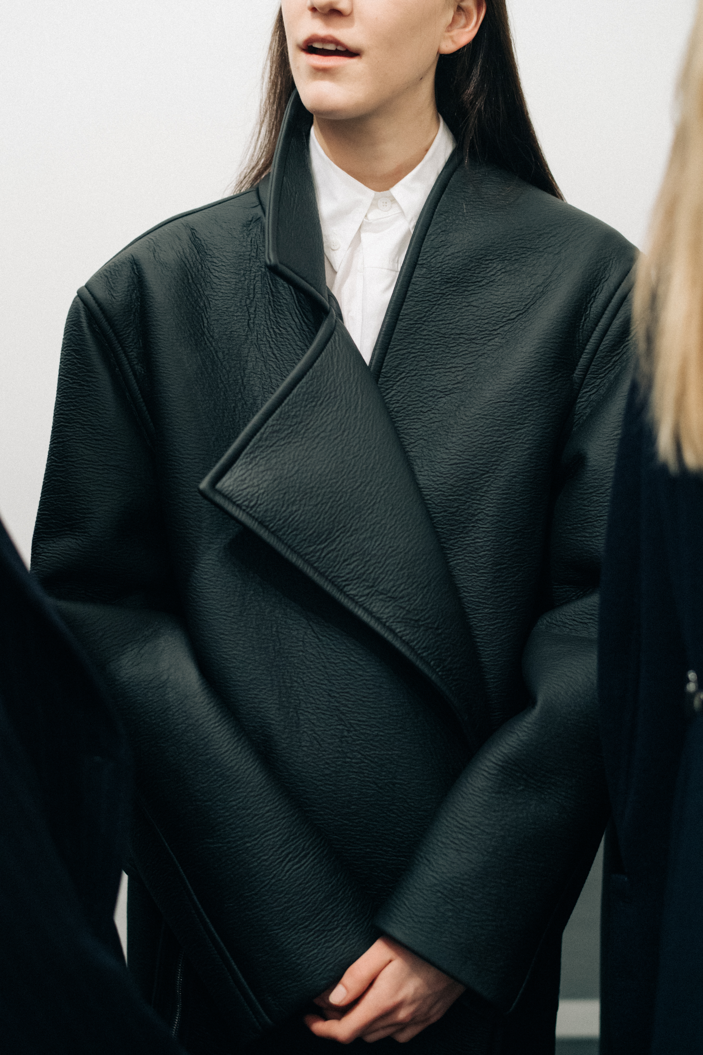 Model wearing a leather Nehera coat