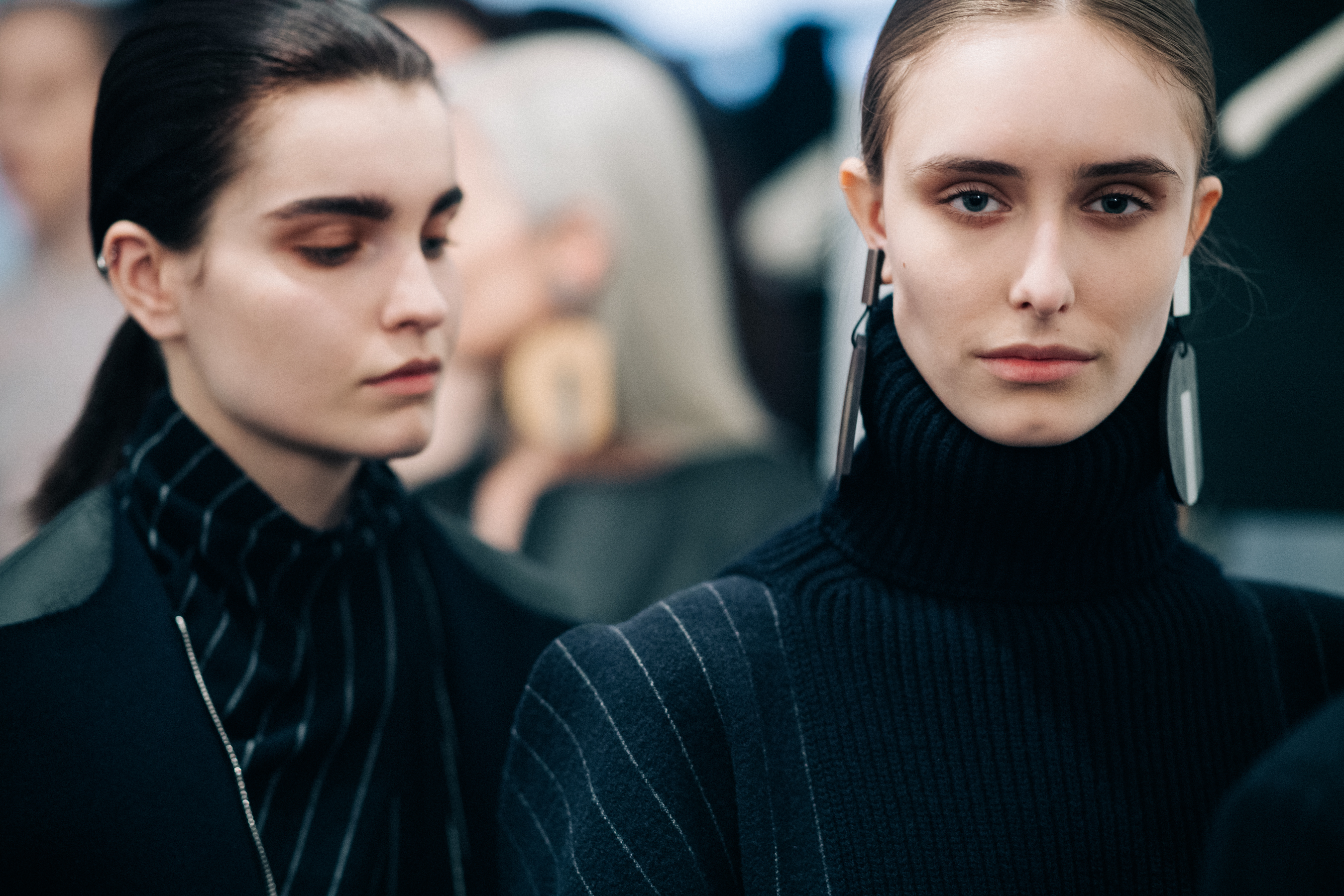 Two models wearing striped Nehera looks