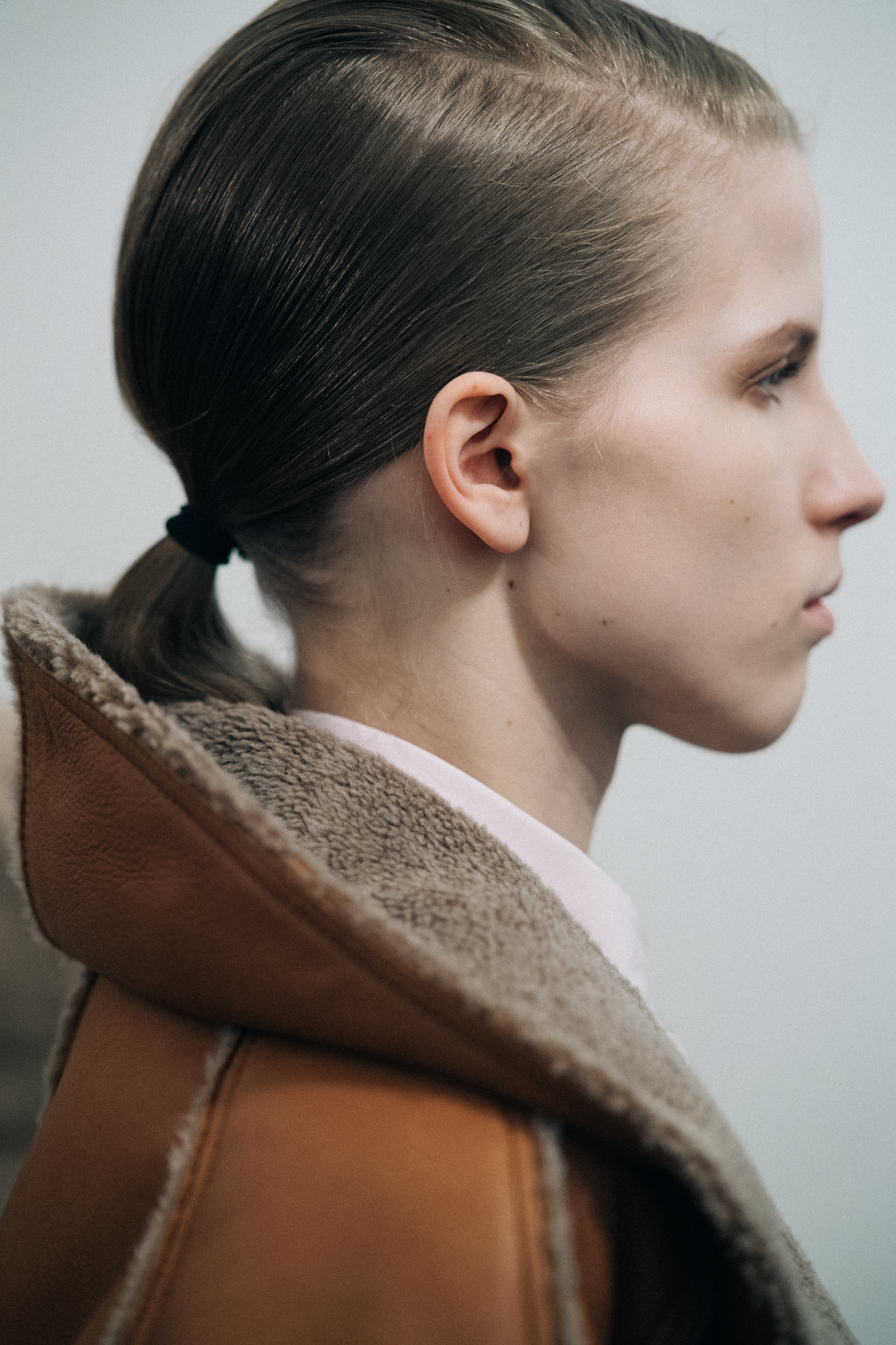 Profile of a model wearing a pilot jacket