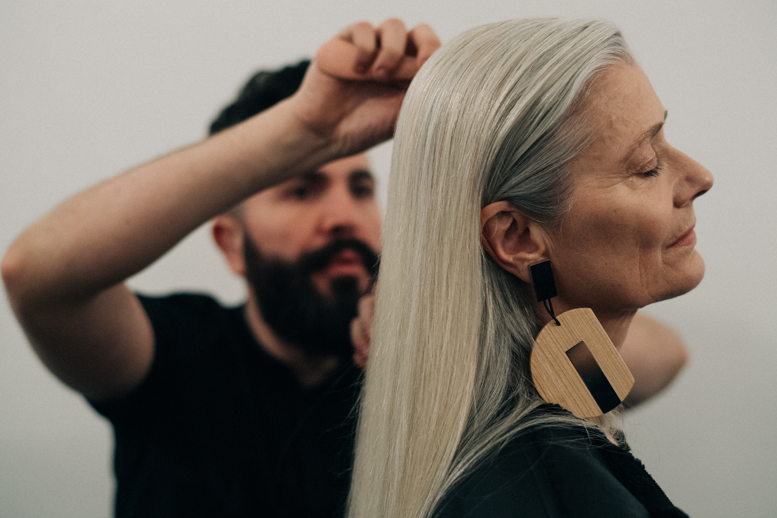 Elder model getting her hair done