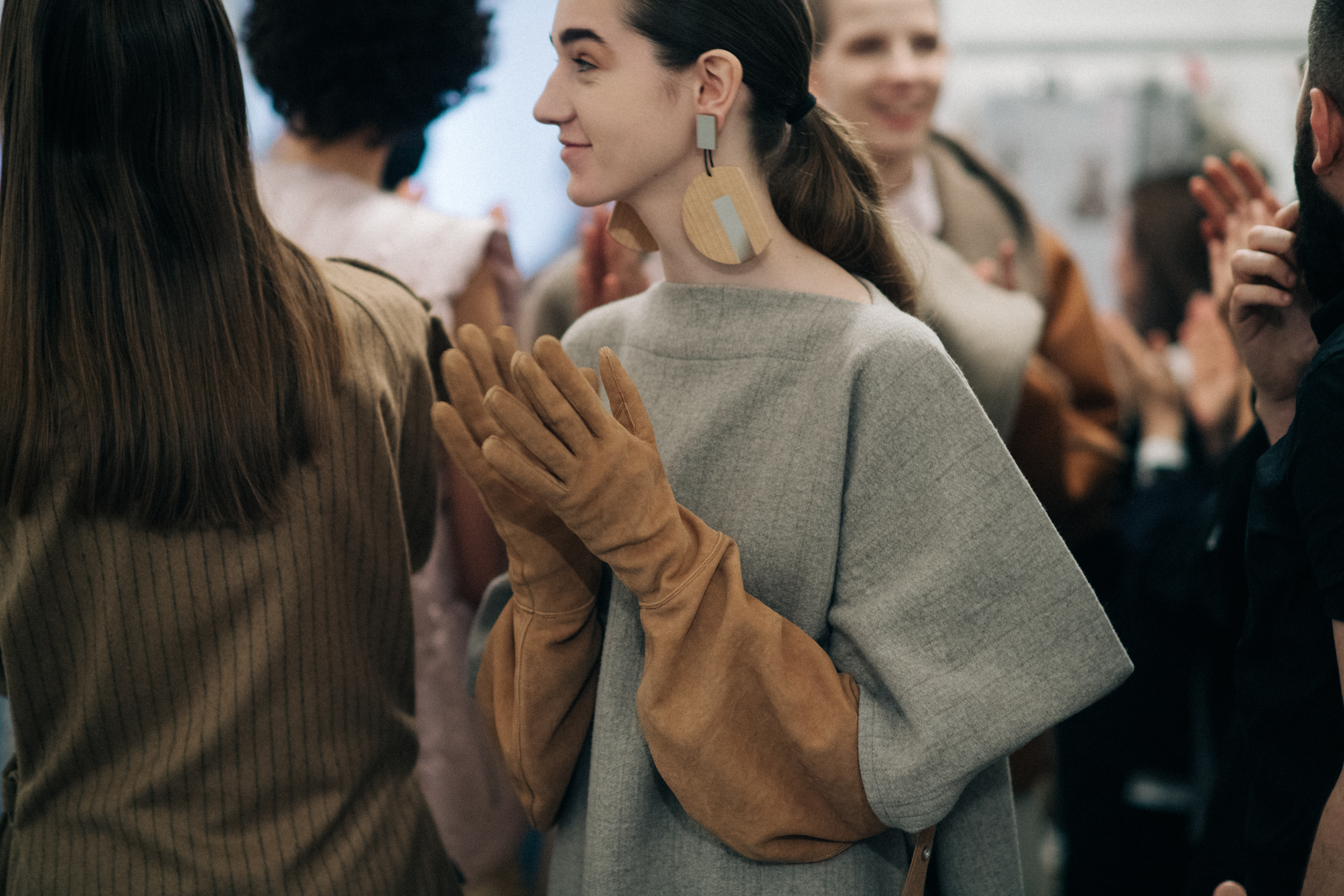Model wearing oversized Nehera gloves