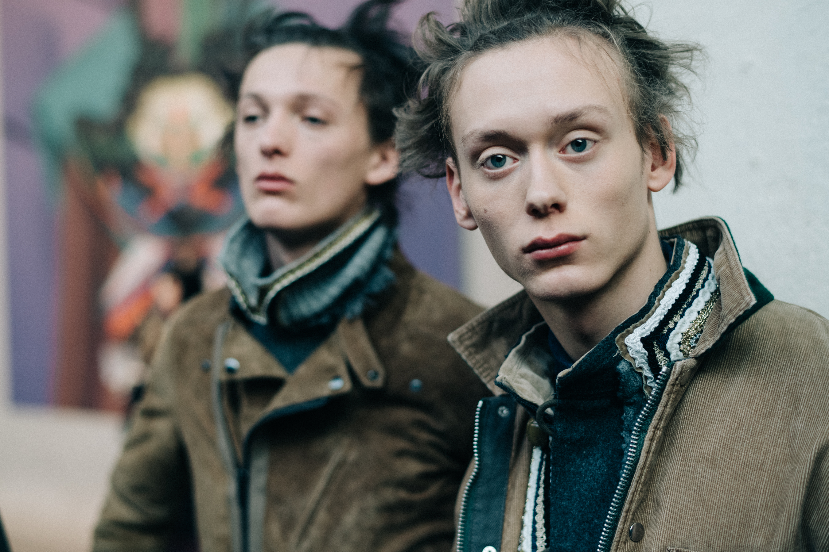 Male models at Sacai backstage