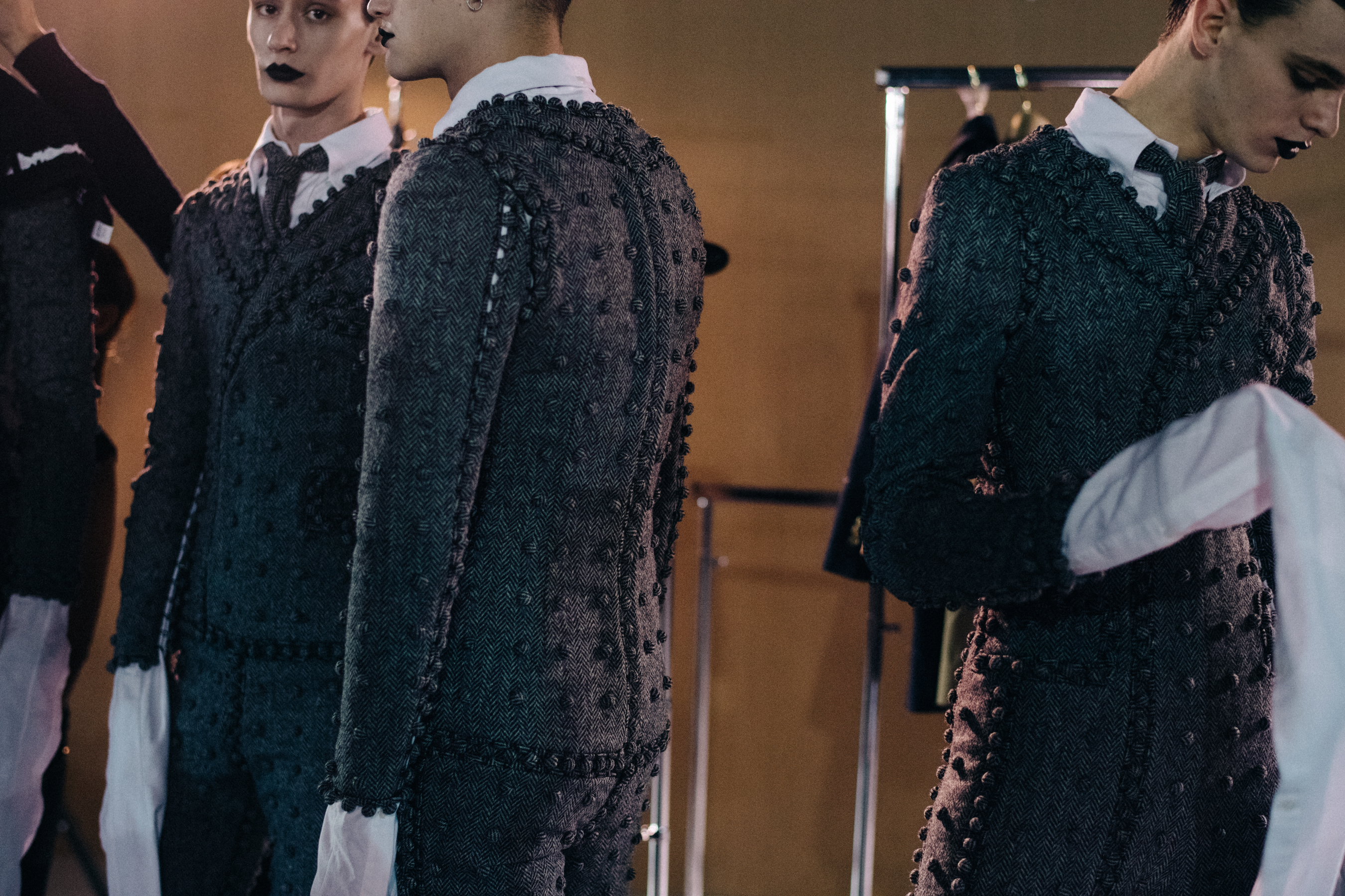 Male models at Thom Browne backstage