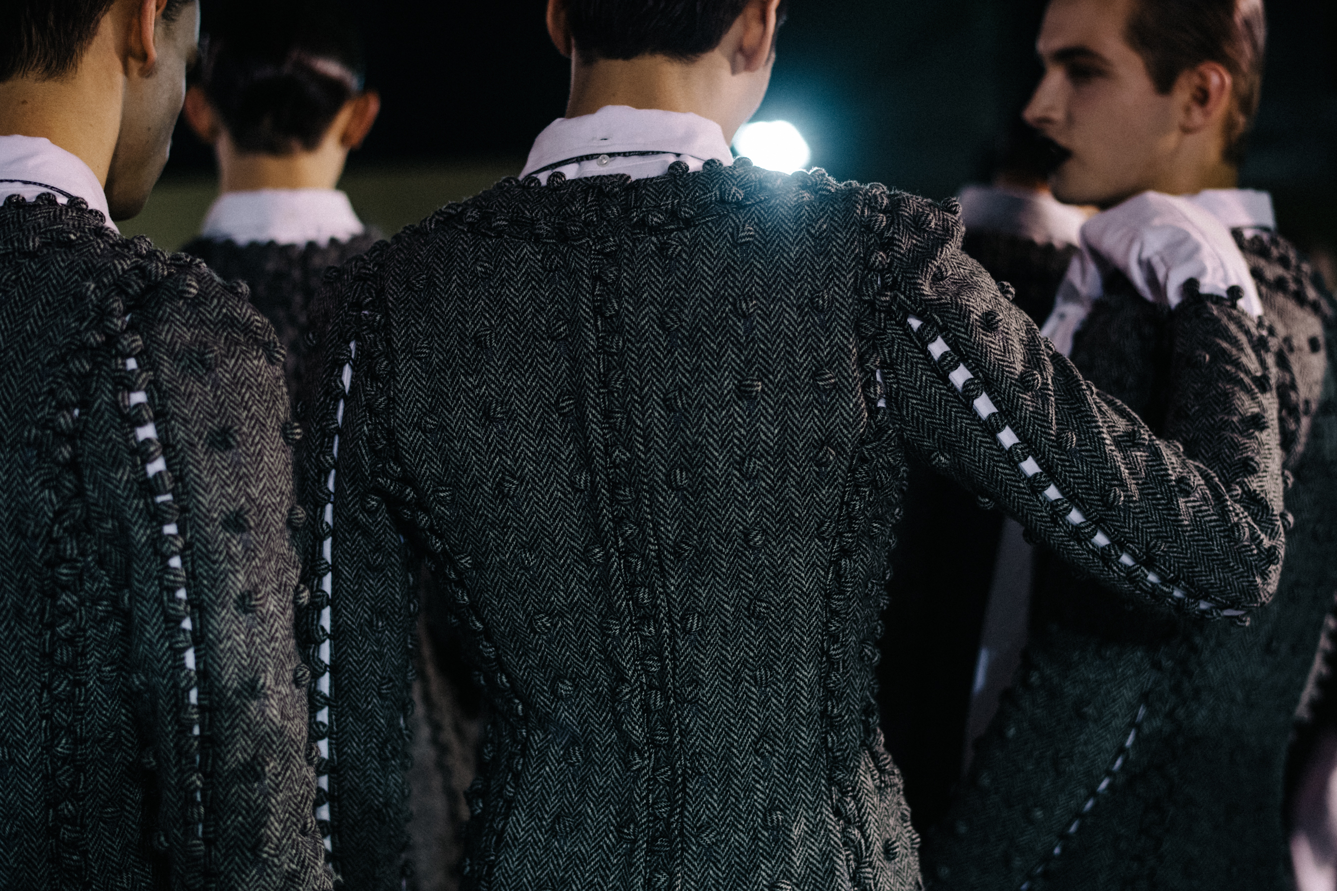 Back detail of a Thom Browne jacket