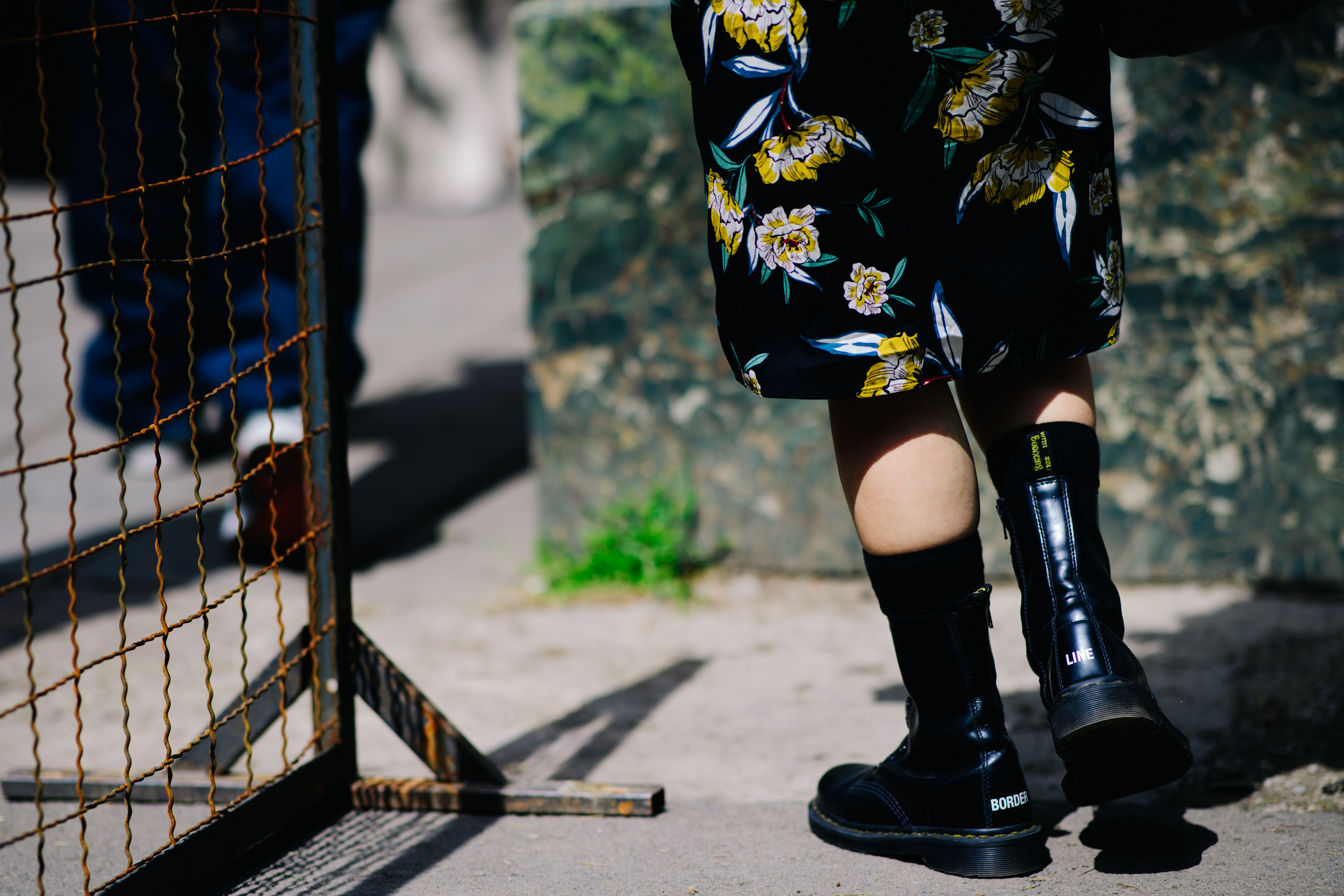 Girl wearing black combat boots