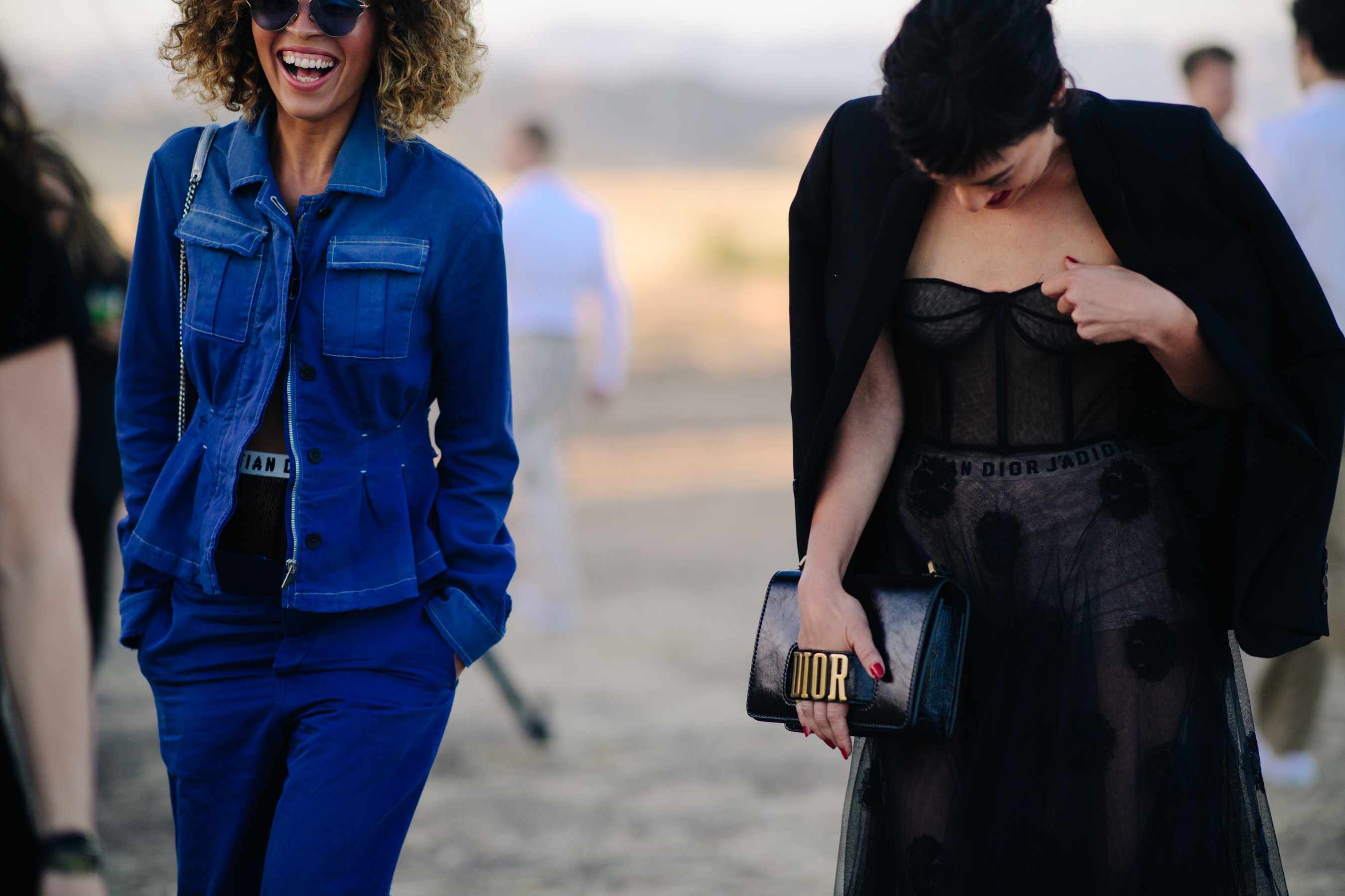 Two girls wearing contrasting Dior looks