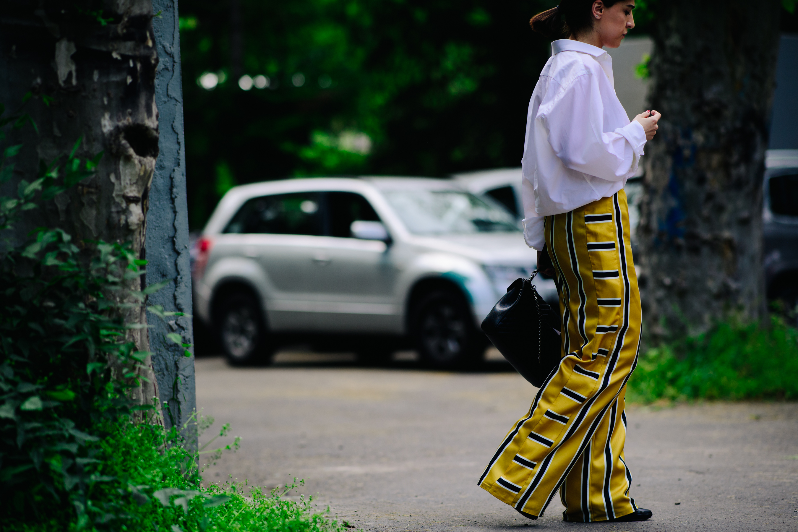 Girl wearing large striped yellow trousers