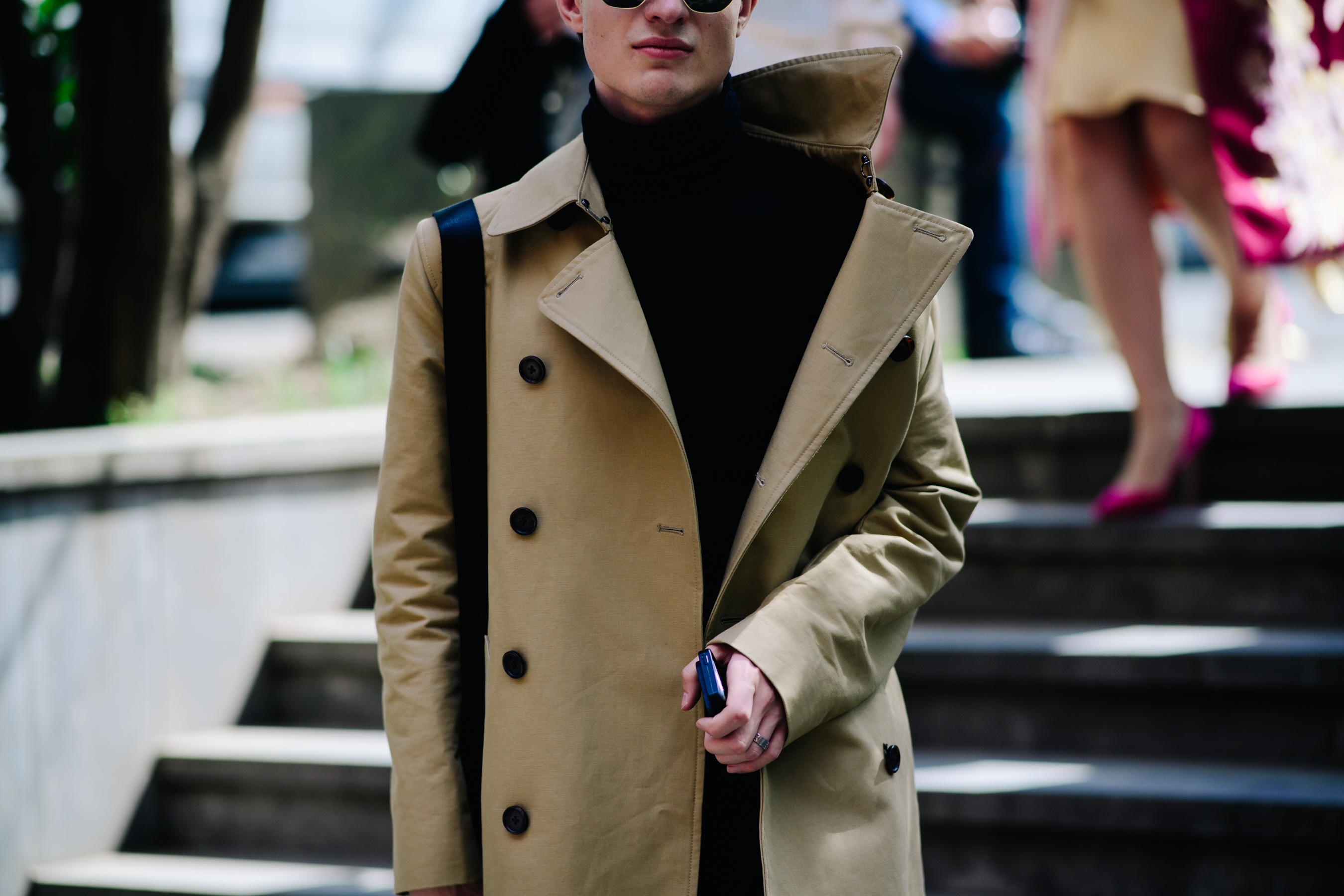 Boy wearing a long beige coat
