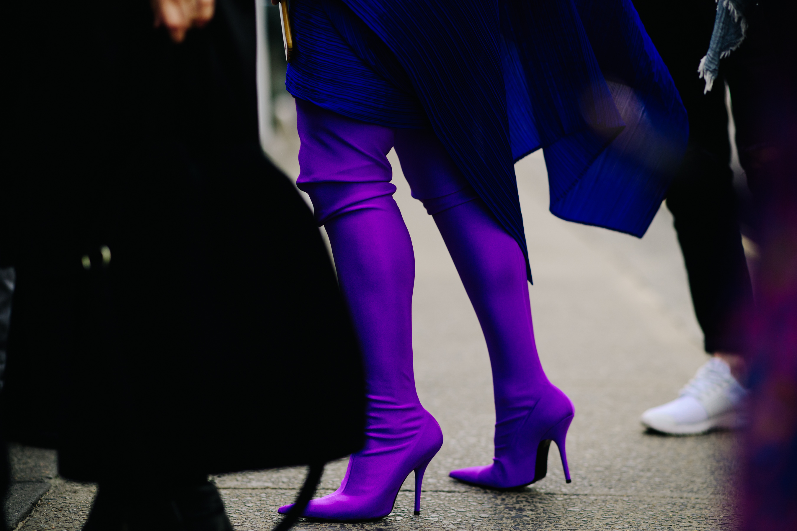 Woman wearing Balenciaga purple boots