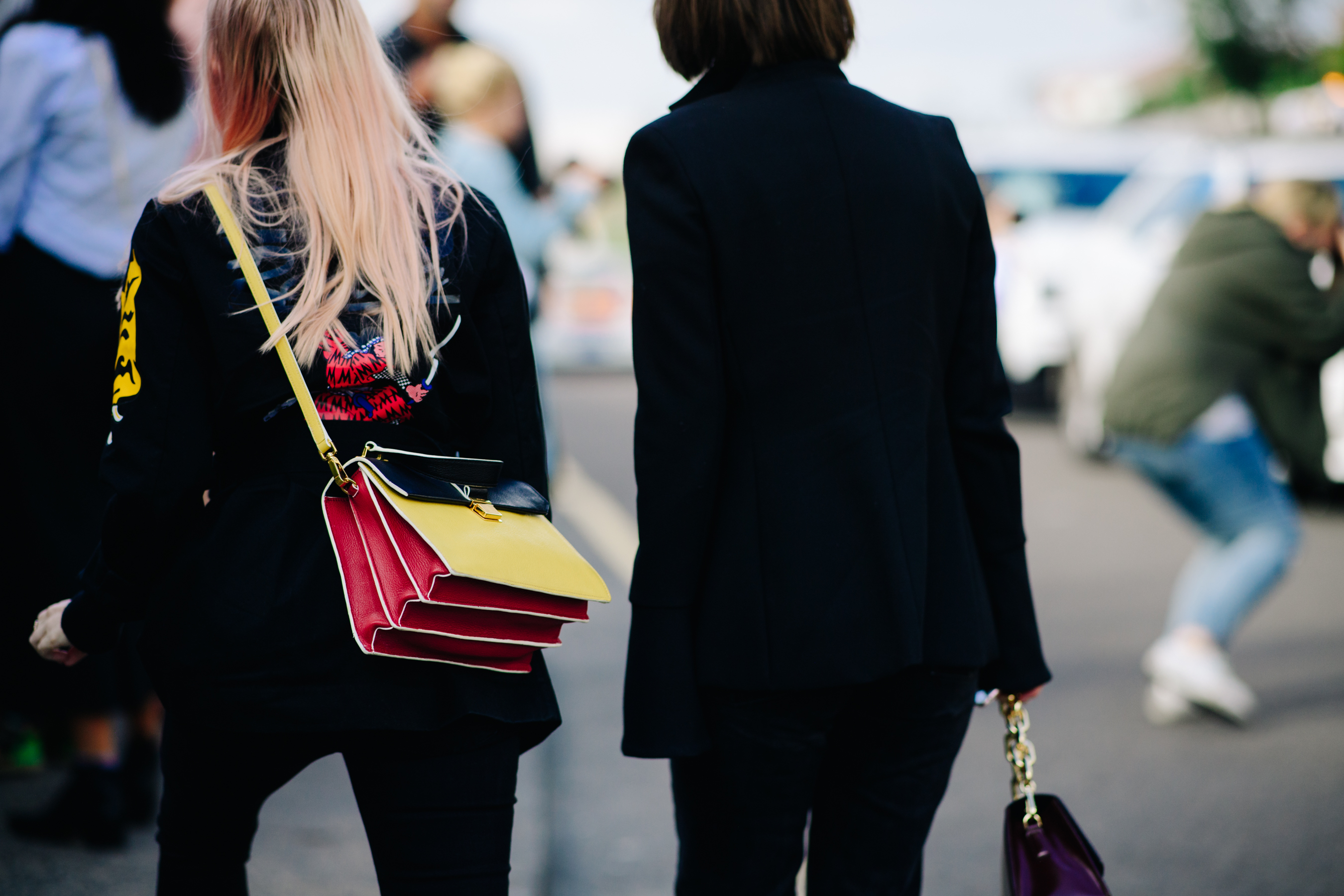 Girl wearing a yellow and red bag