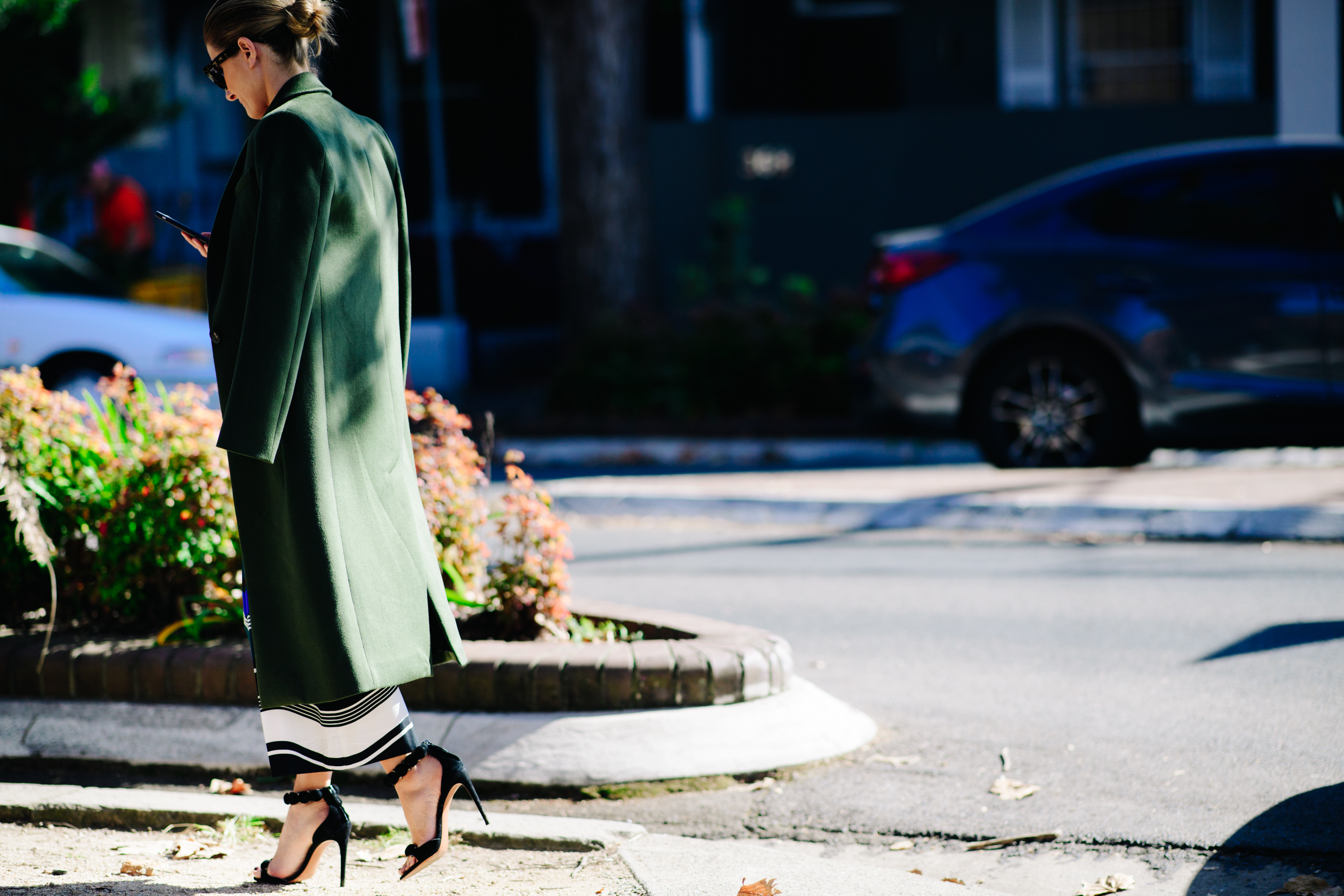 Woman wearing a long green coat