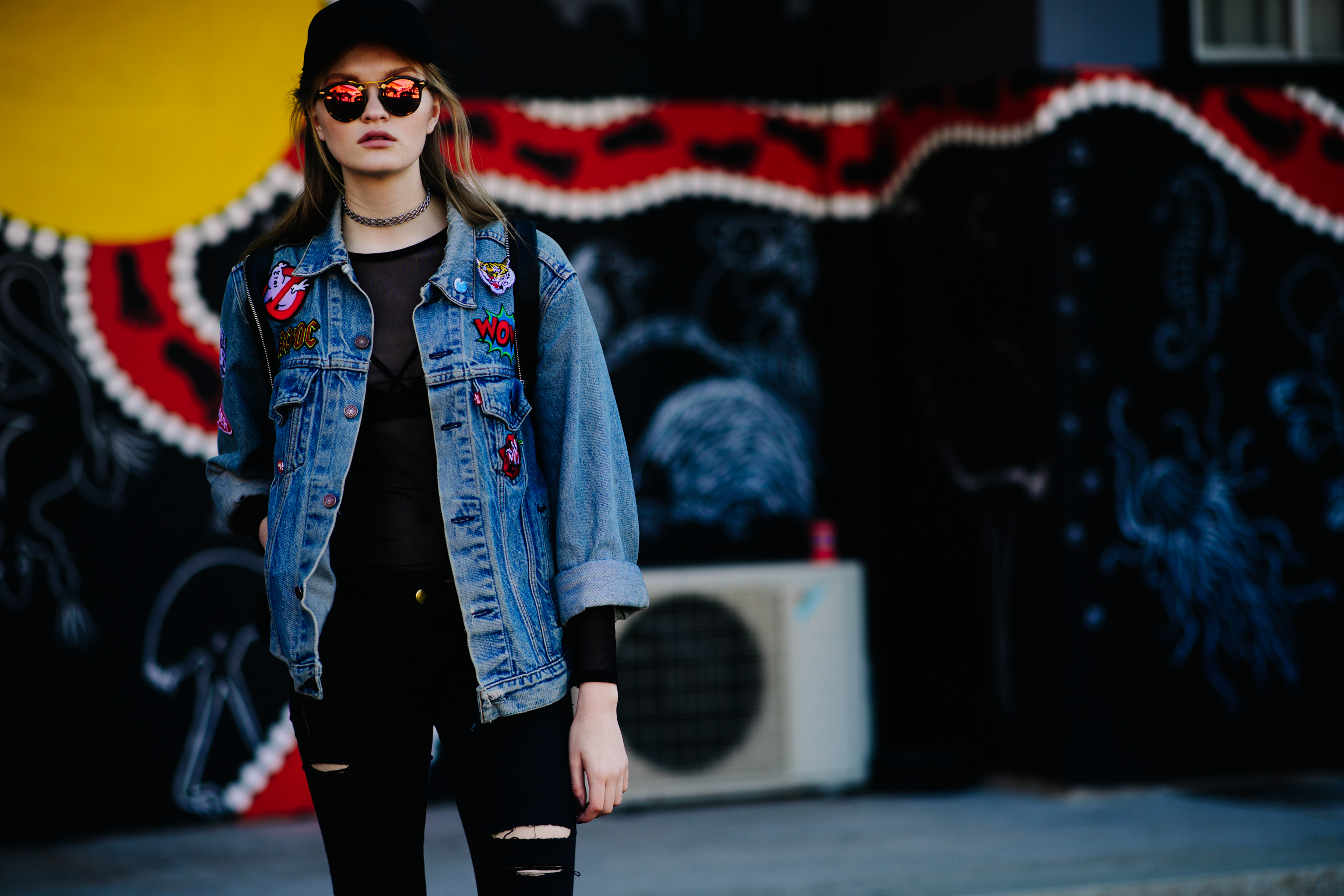 Girl wearing a custom denim jacket
