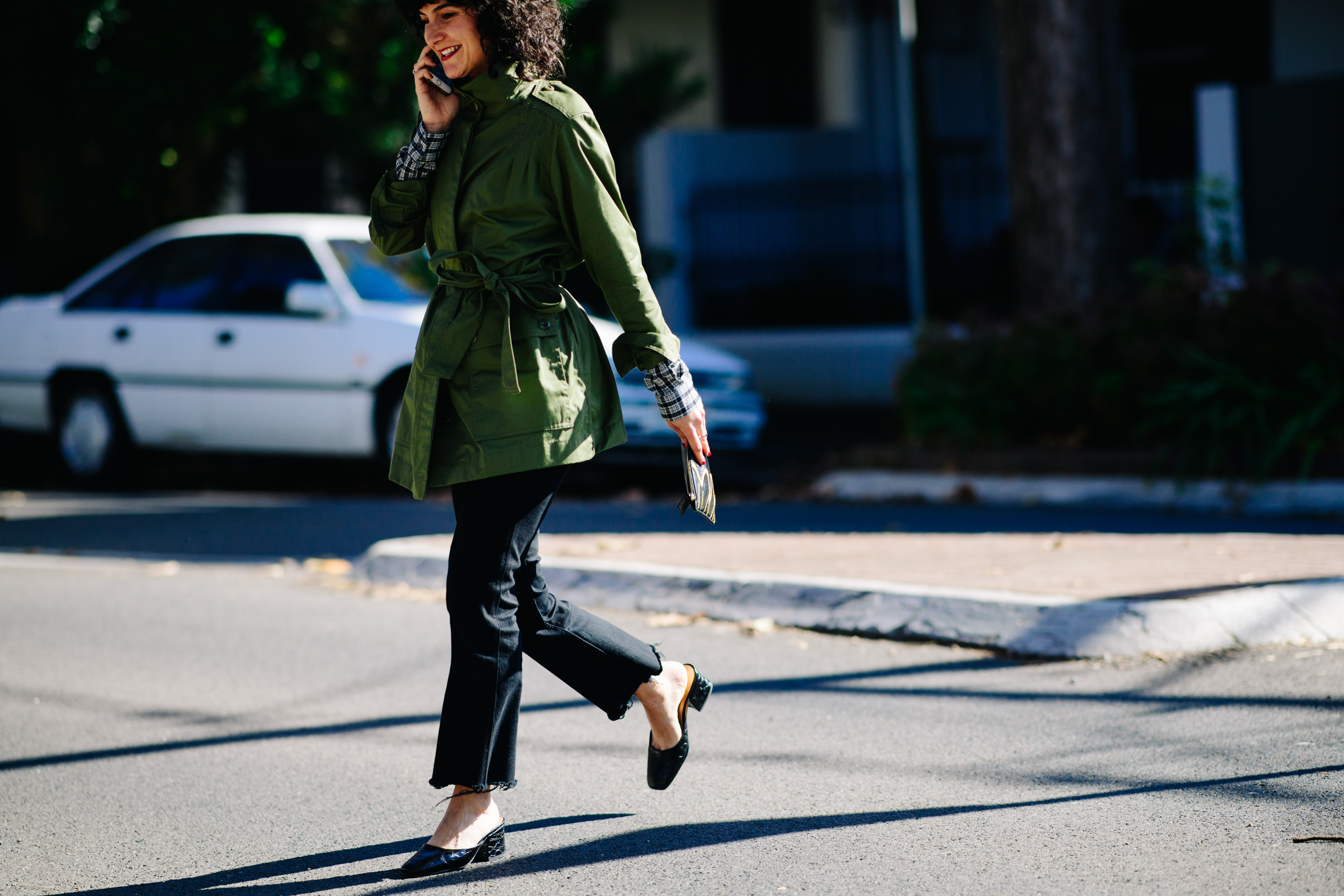 Woman wearing distressed black jeans