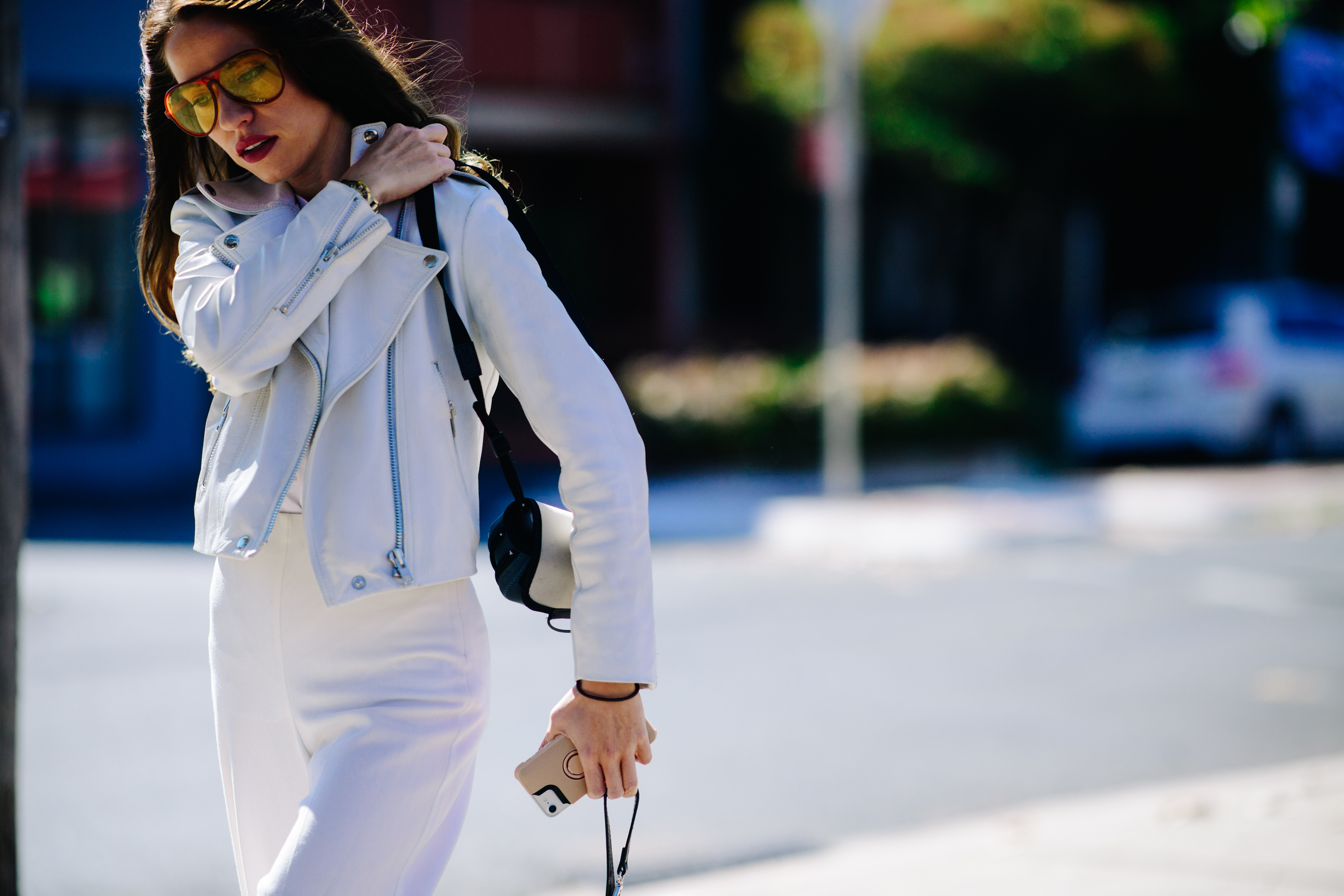 Model wearing a white leather perfecto