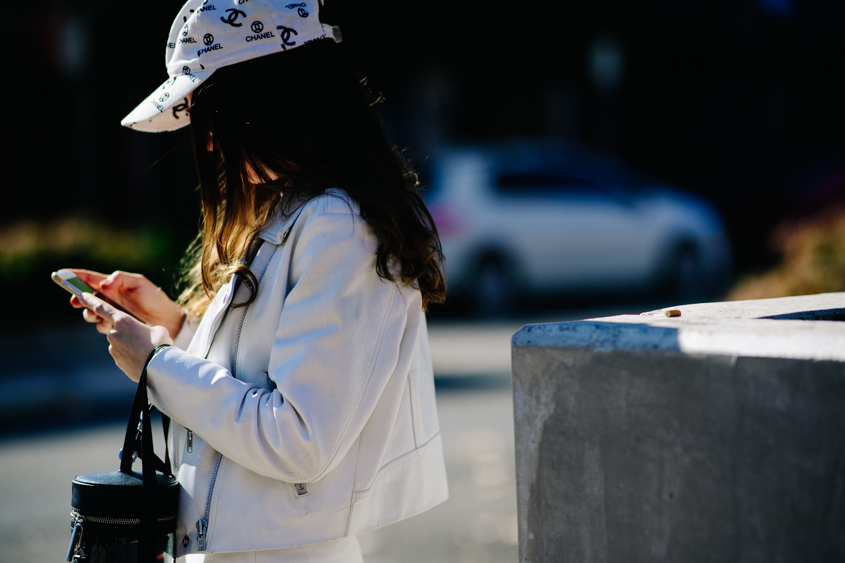 Girl wearing a white Chanel cap