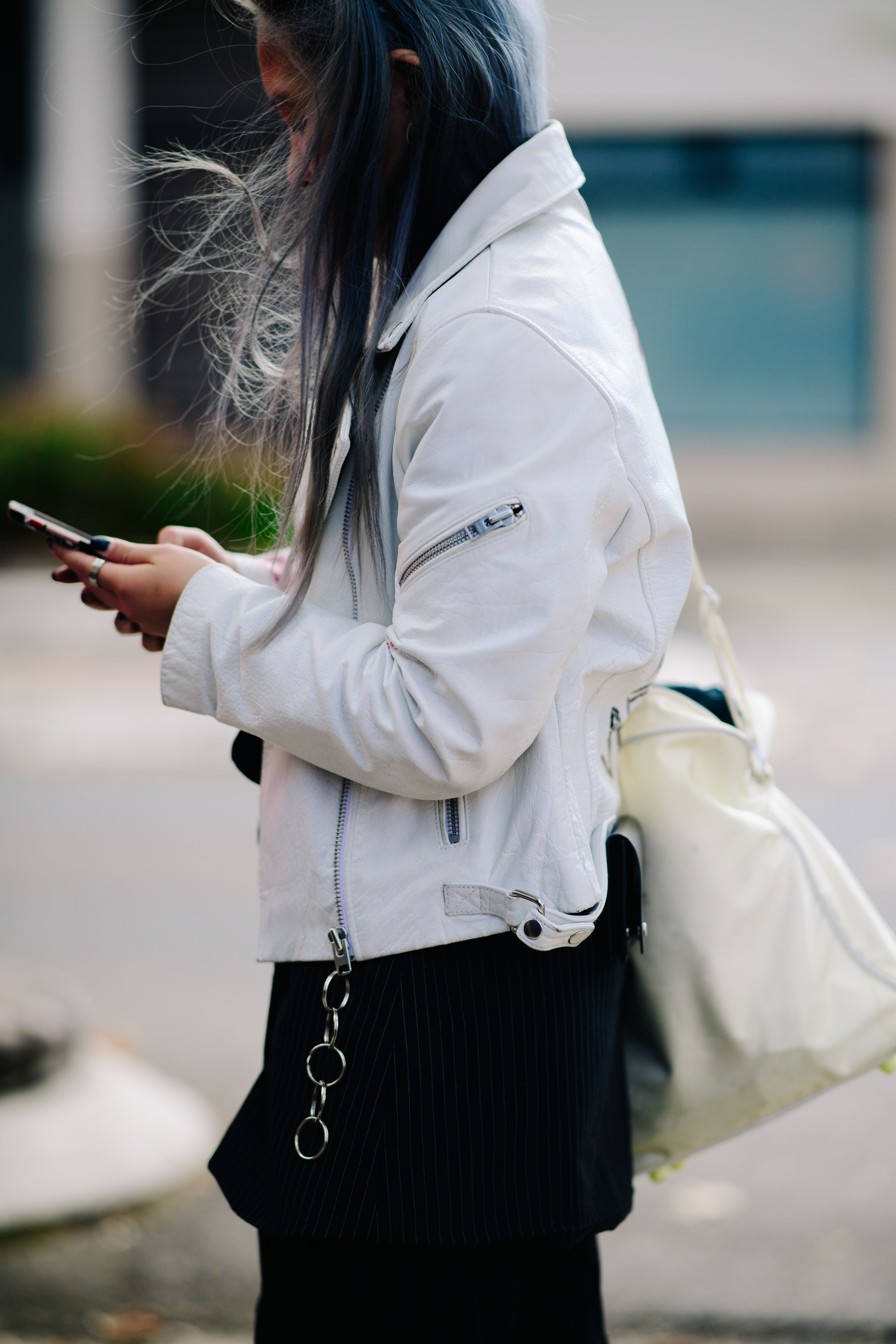 Girl wearing a white leather jacket
