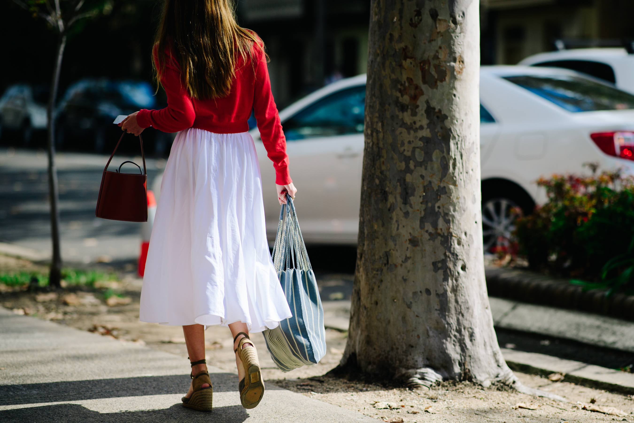 Girl carrying a tissue shopping bag