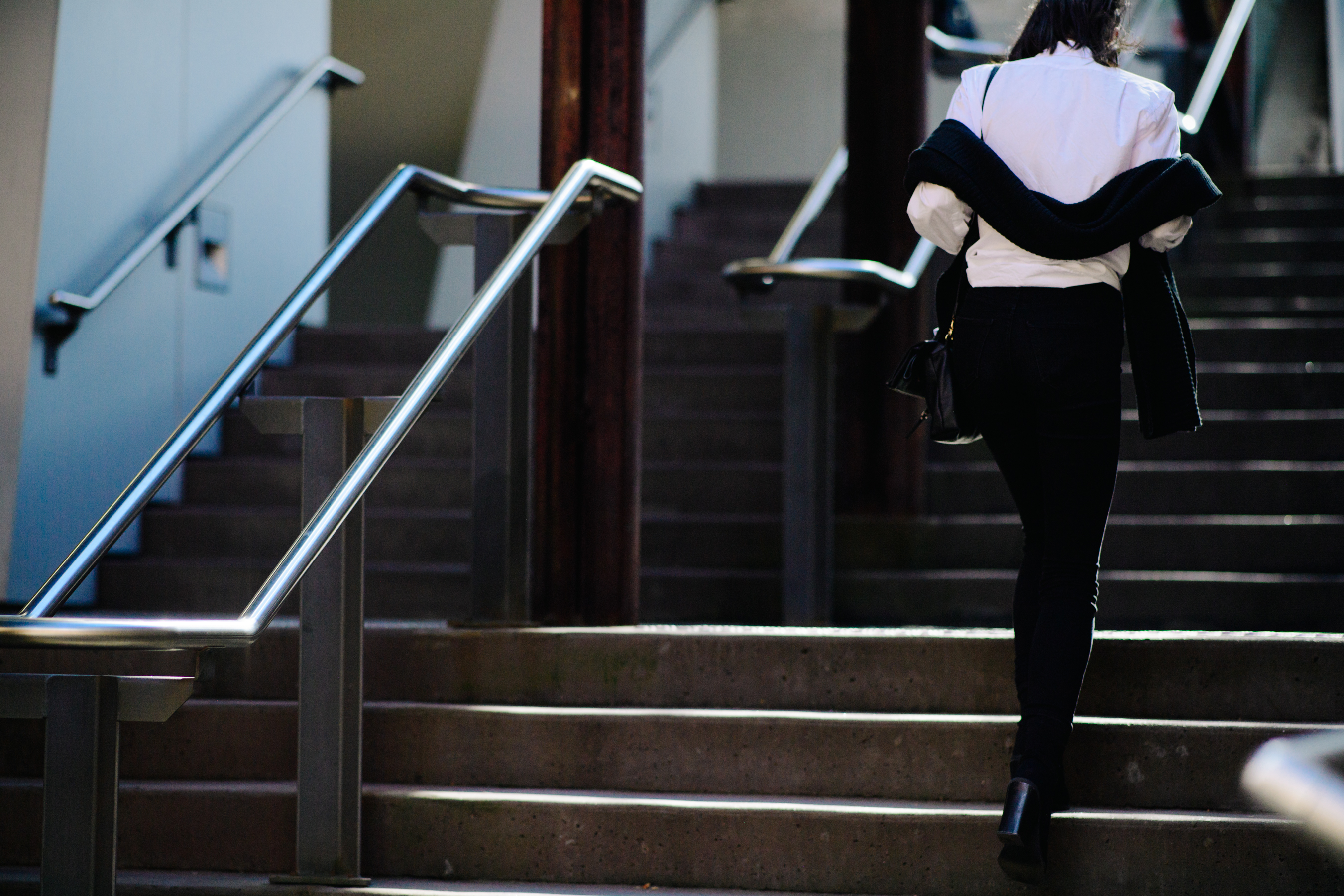Woman carrying a black scarf
