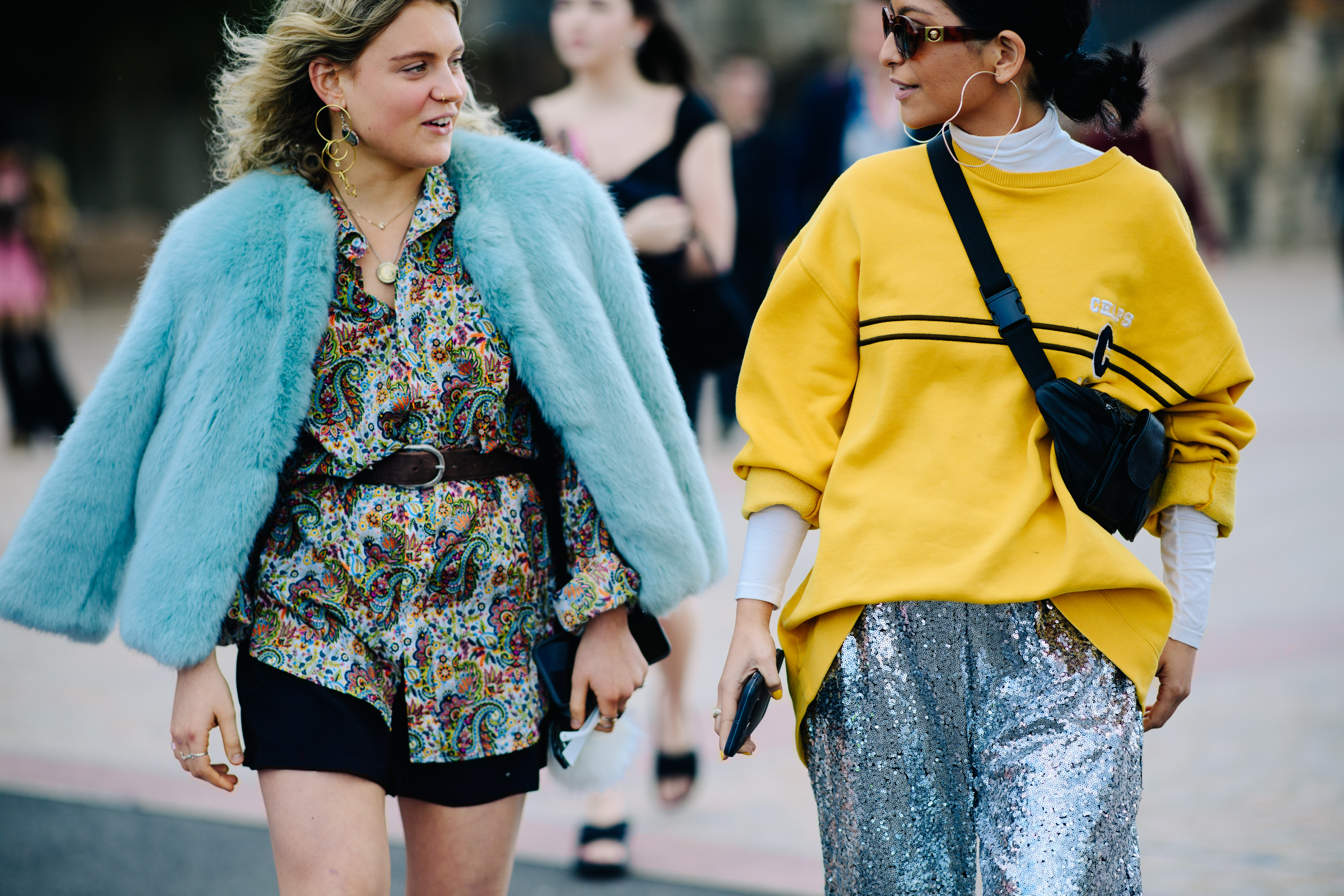 Two girls wearing colourful outfits