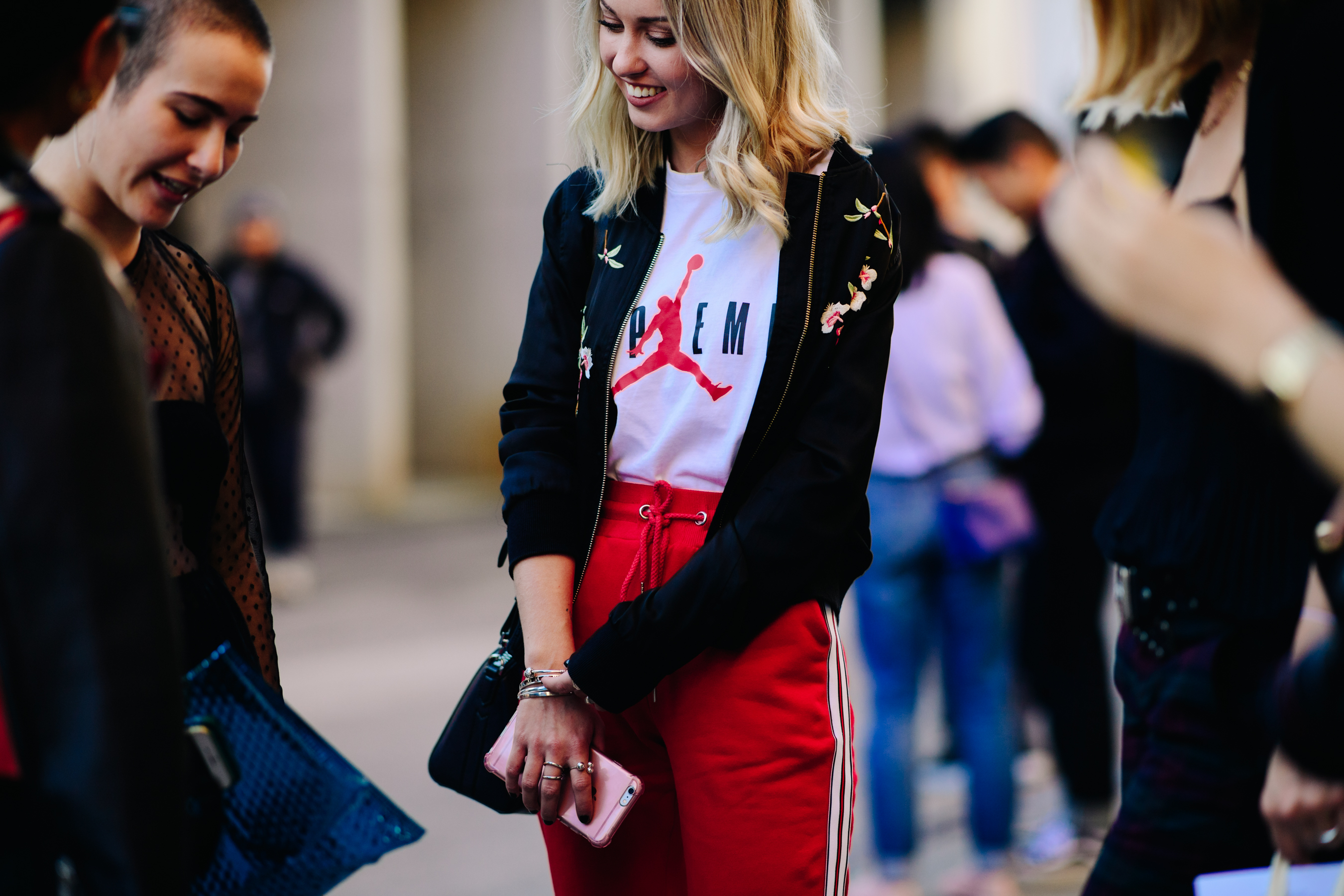 Blond Girl wearing red track pants
