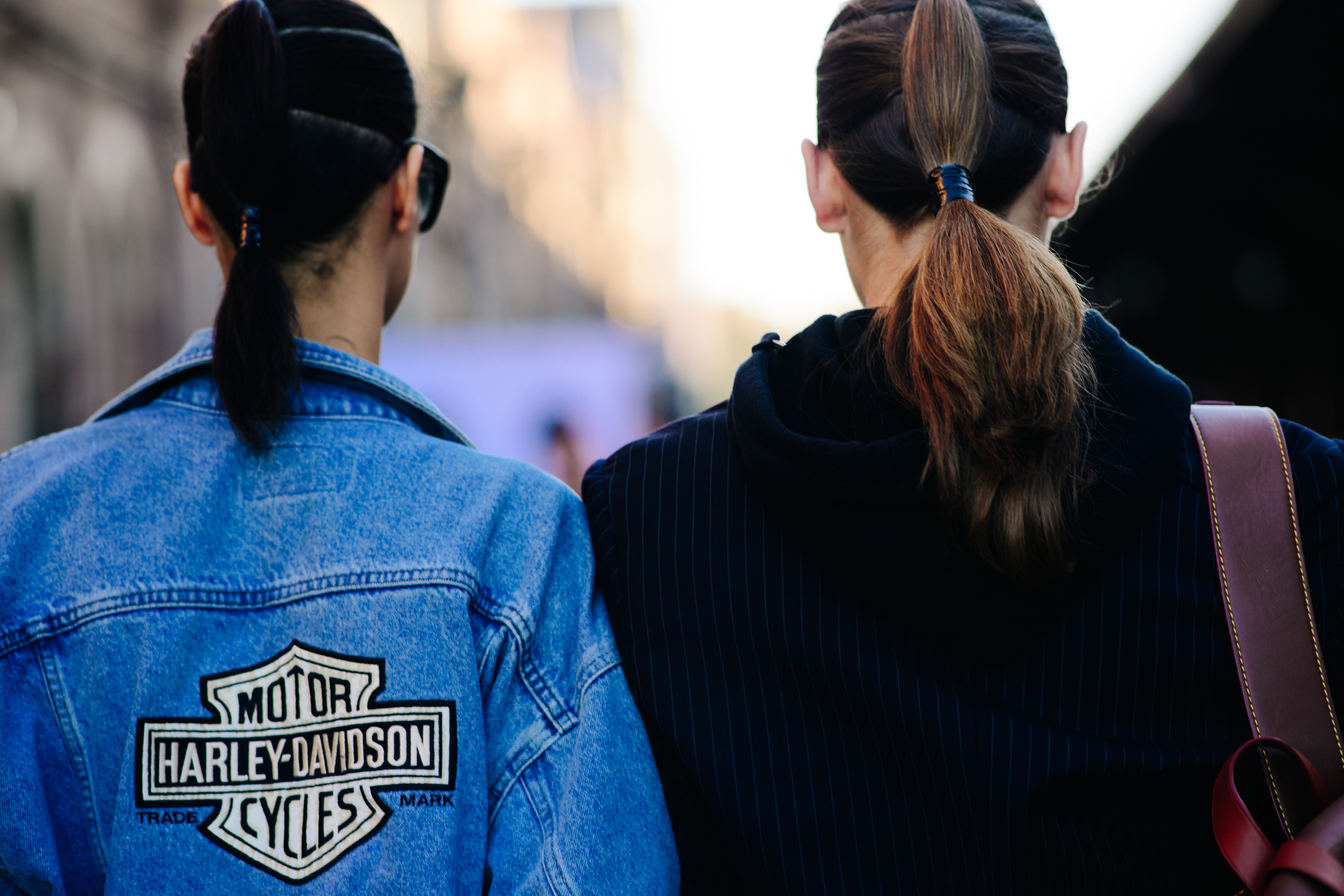 Girl wearing a patch denim jacket