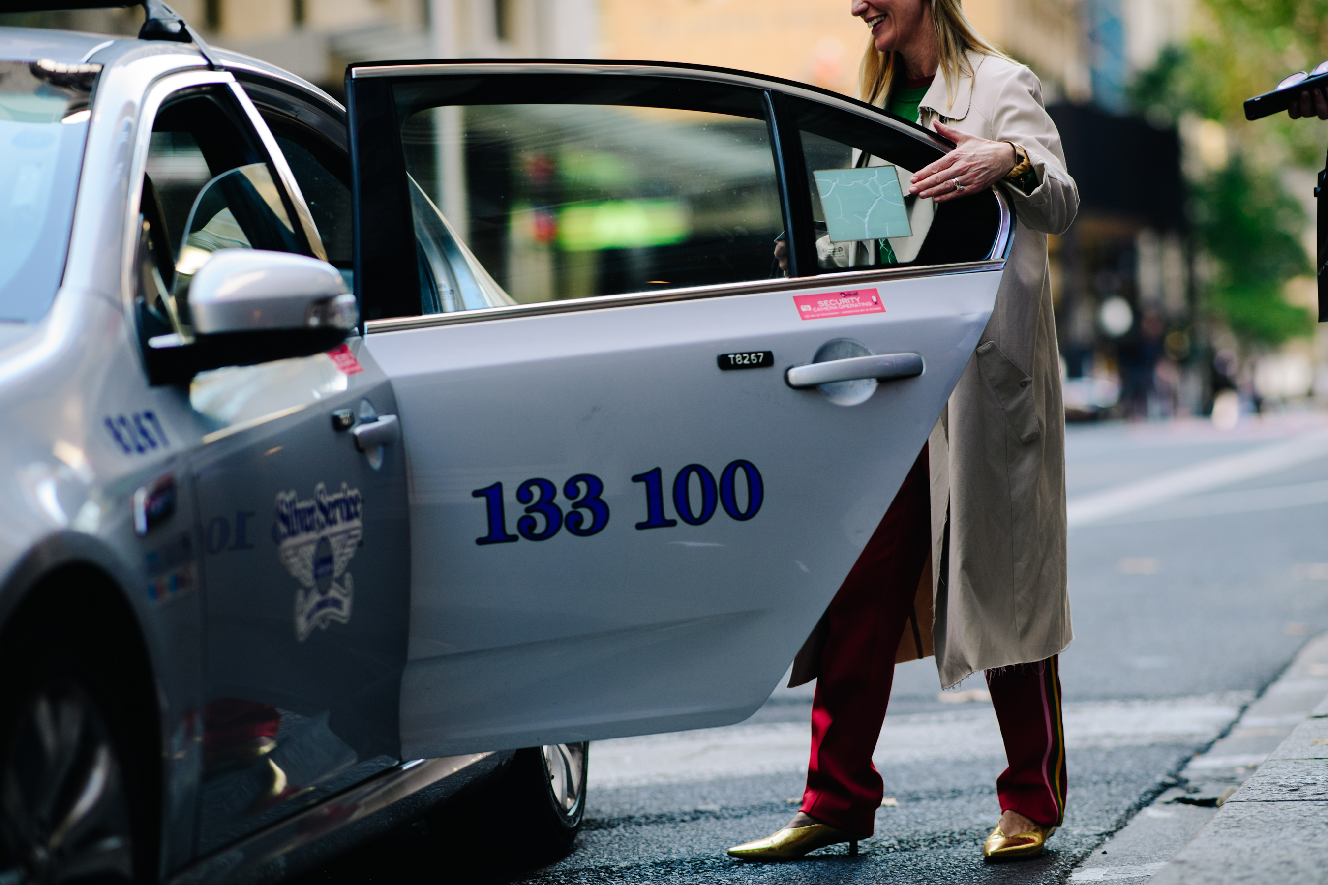 Girl getting inside a cab
