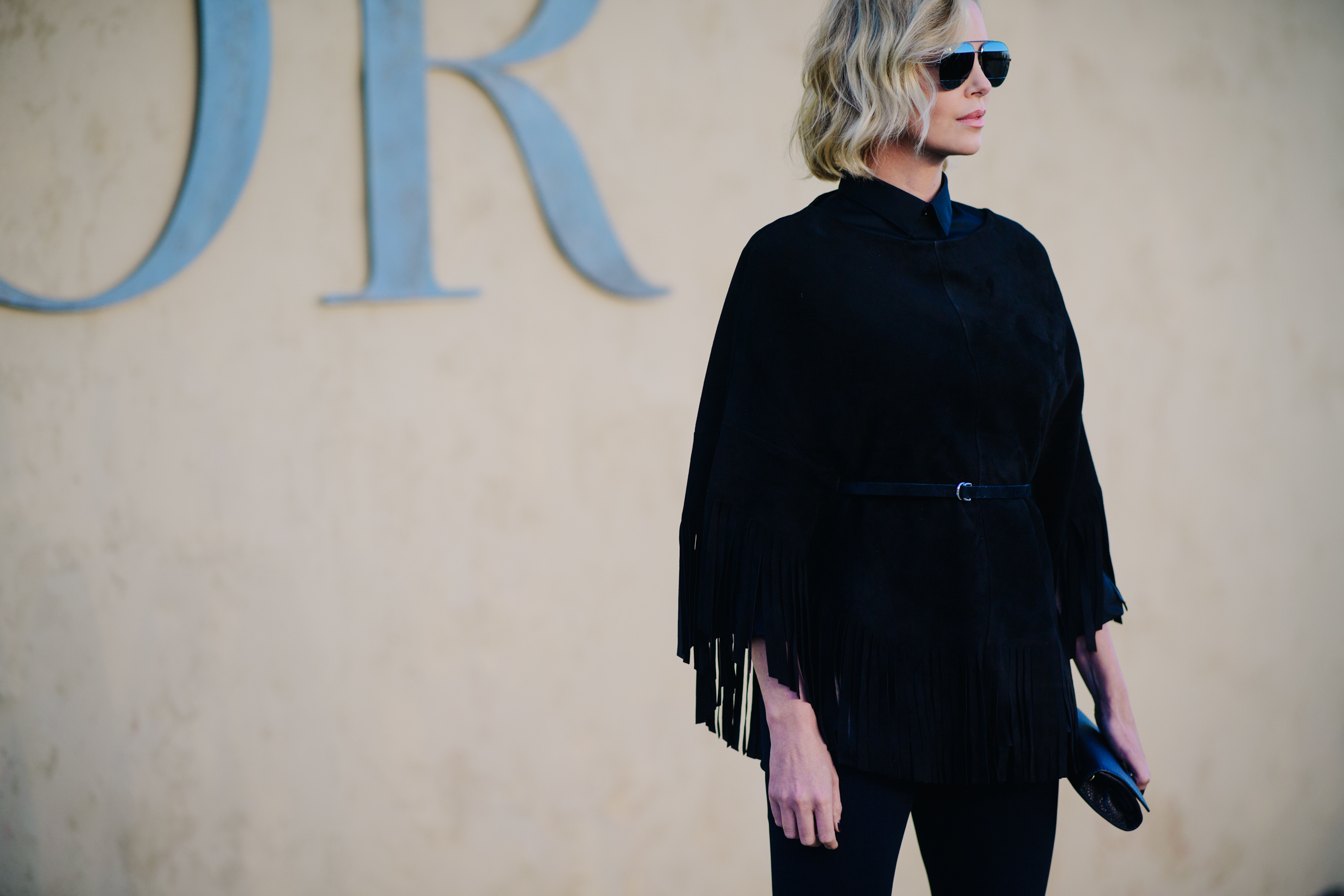 Actress wearing a fringed Dior jacket