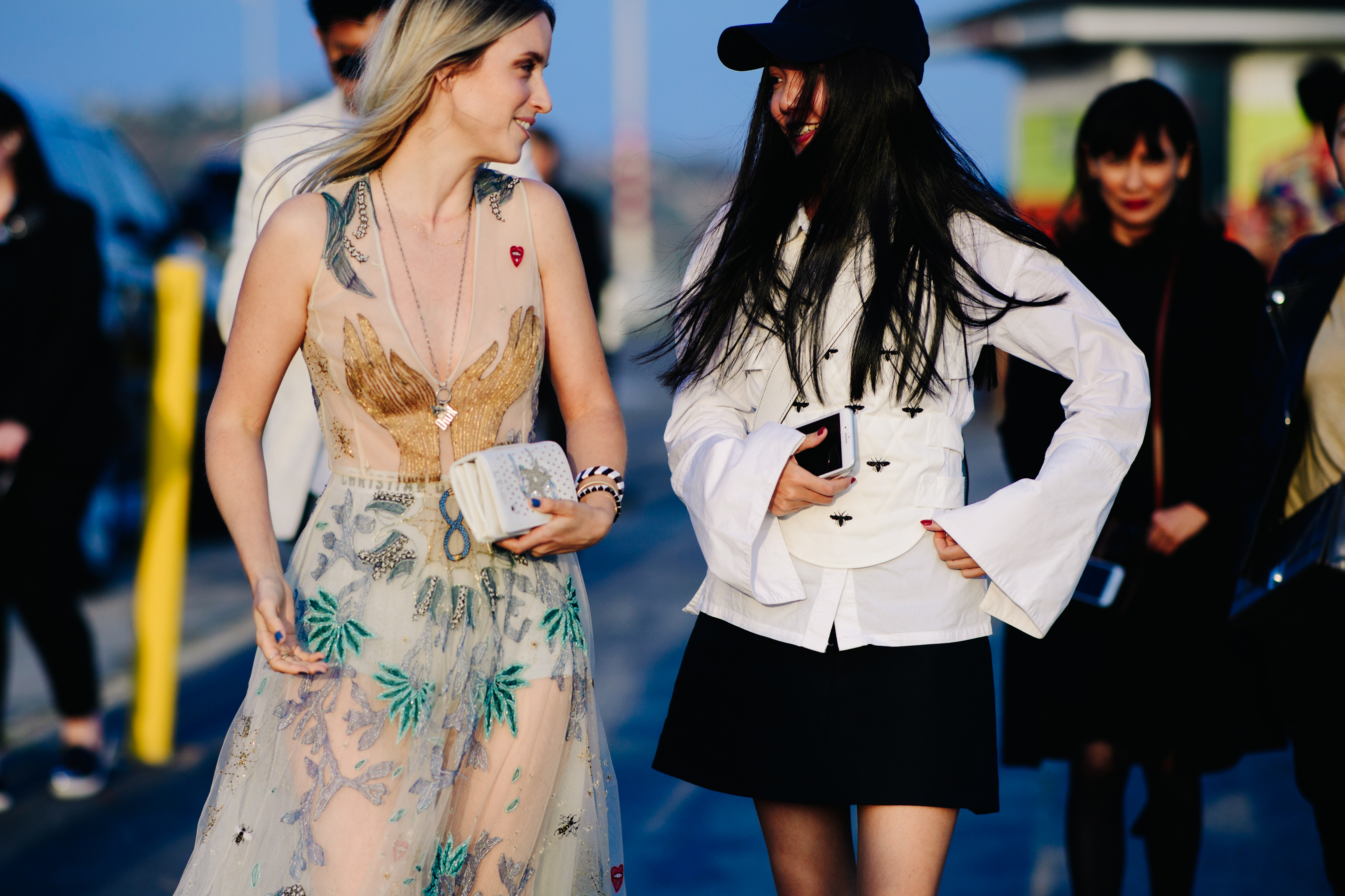 Two girls walking along the pier