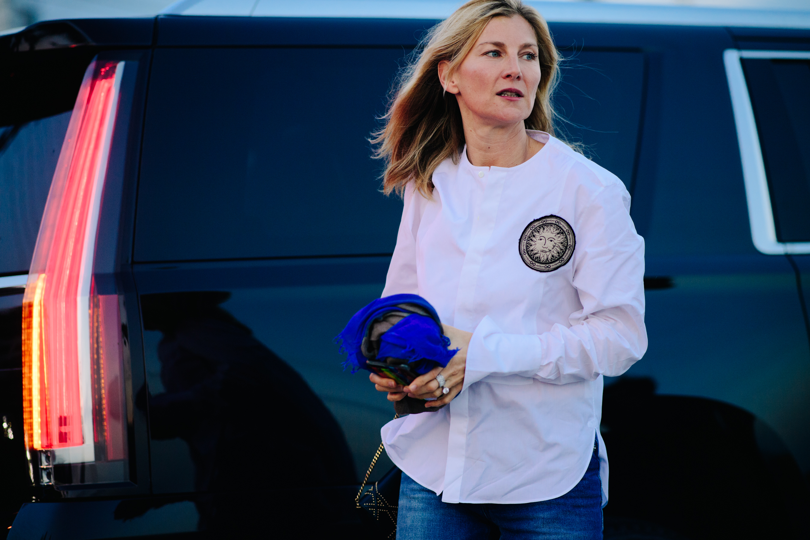 Woman wearing a white embroidered shirt