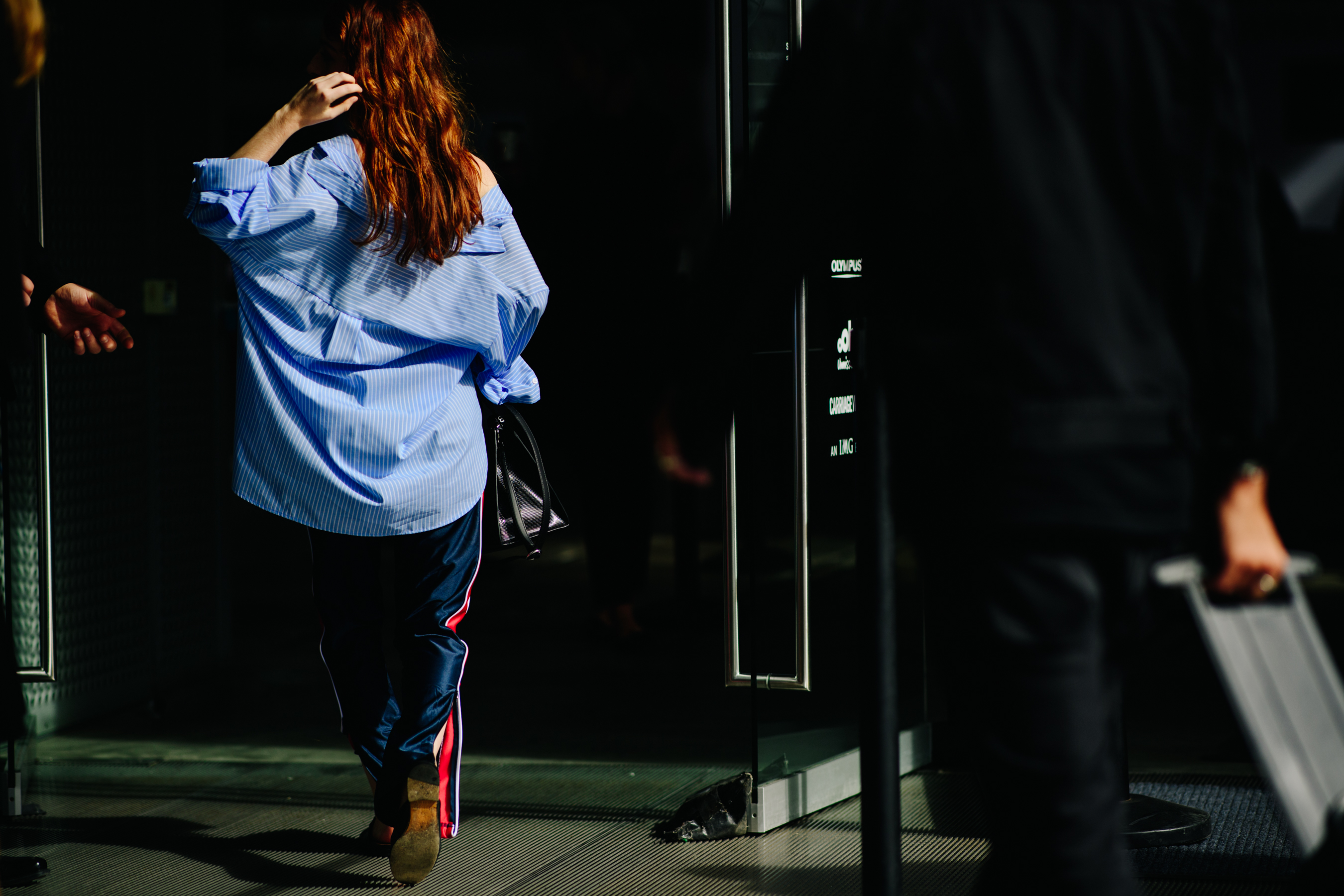 Woman wearing striped track pants