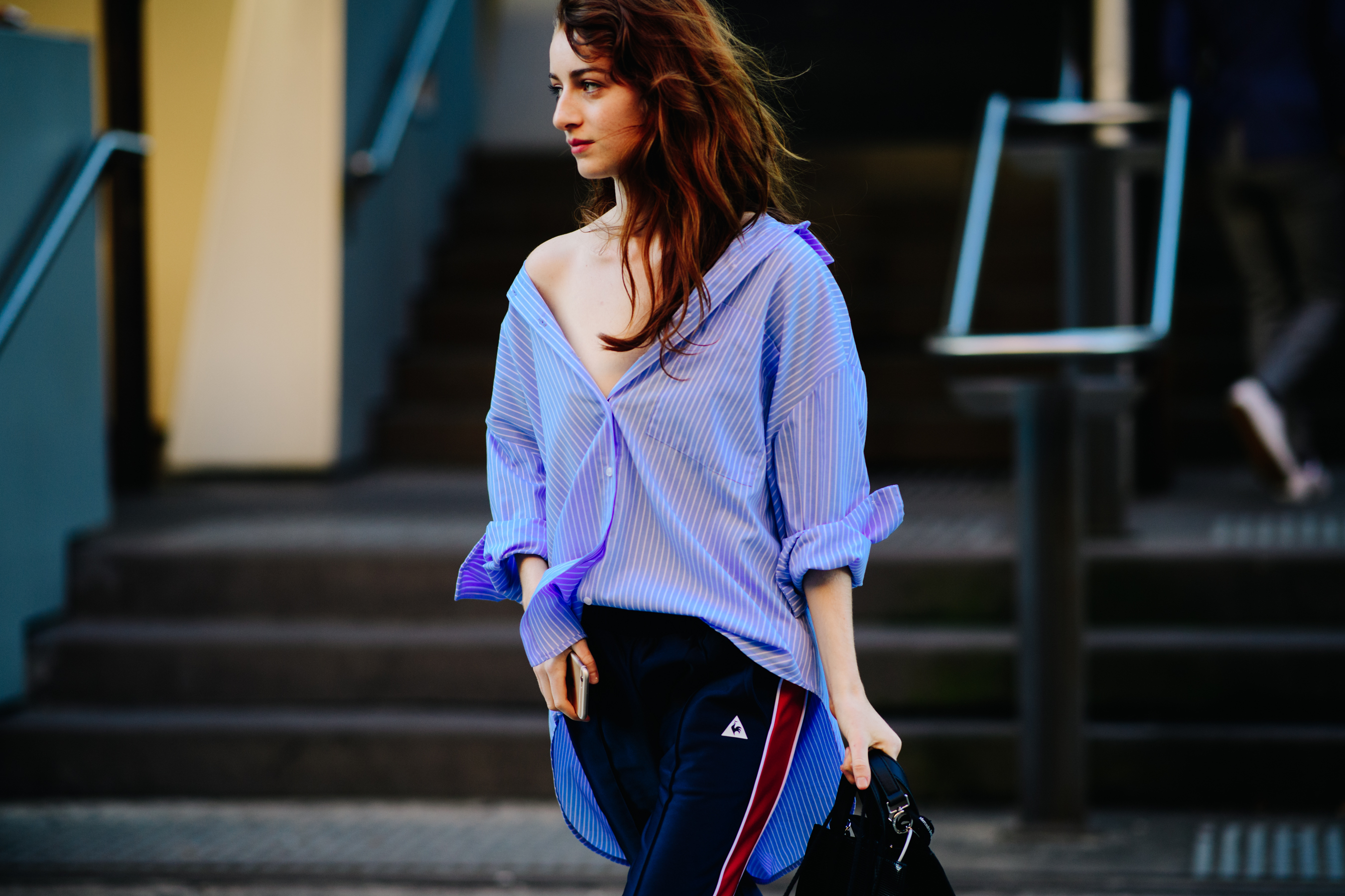 Girl carrying a black leather bag