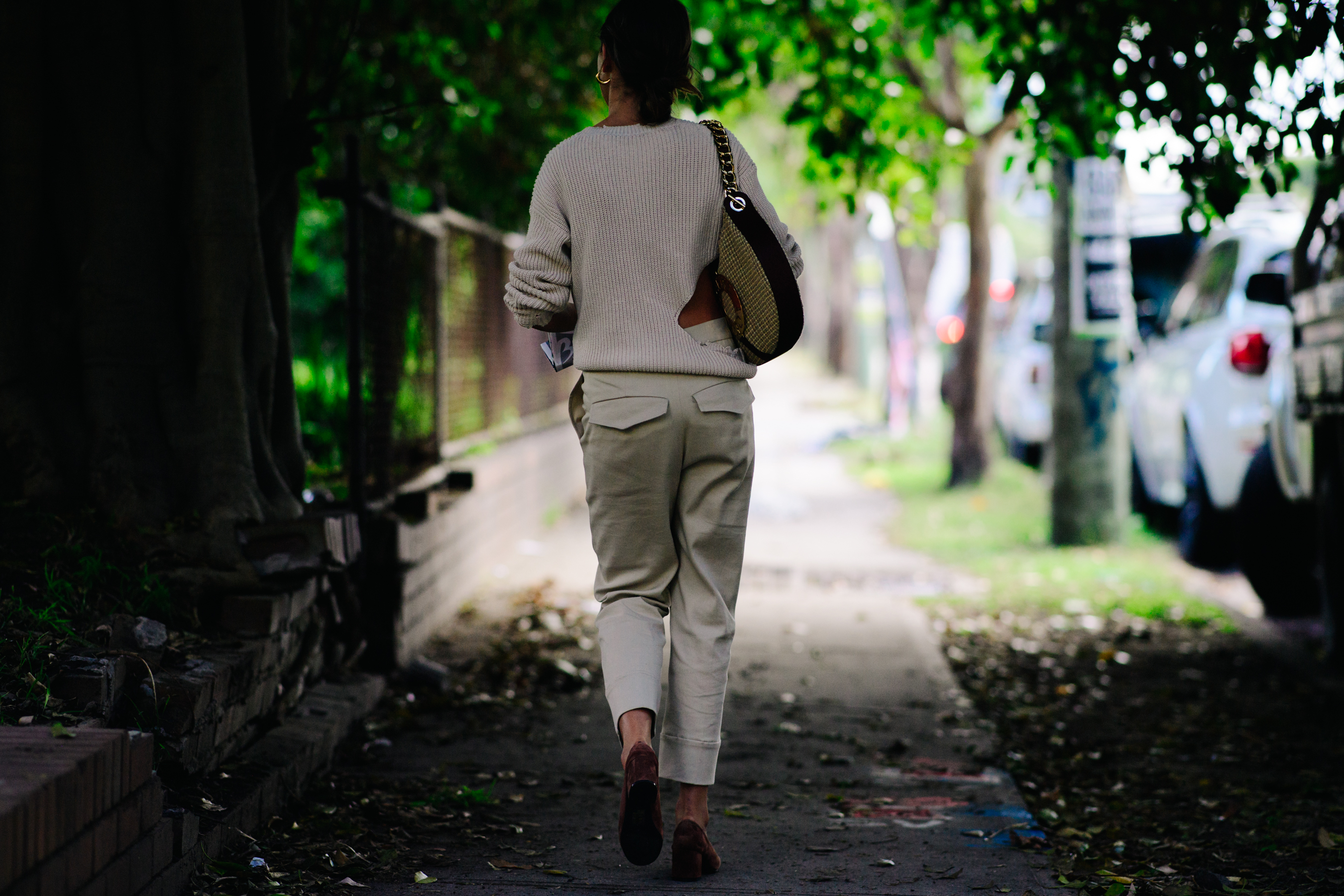Girl wearing a beige knitted sweater