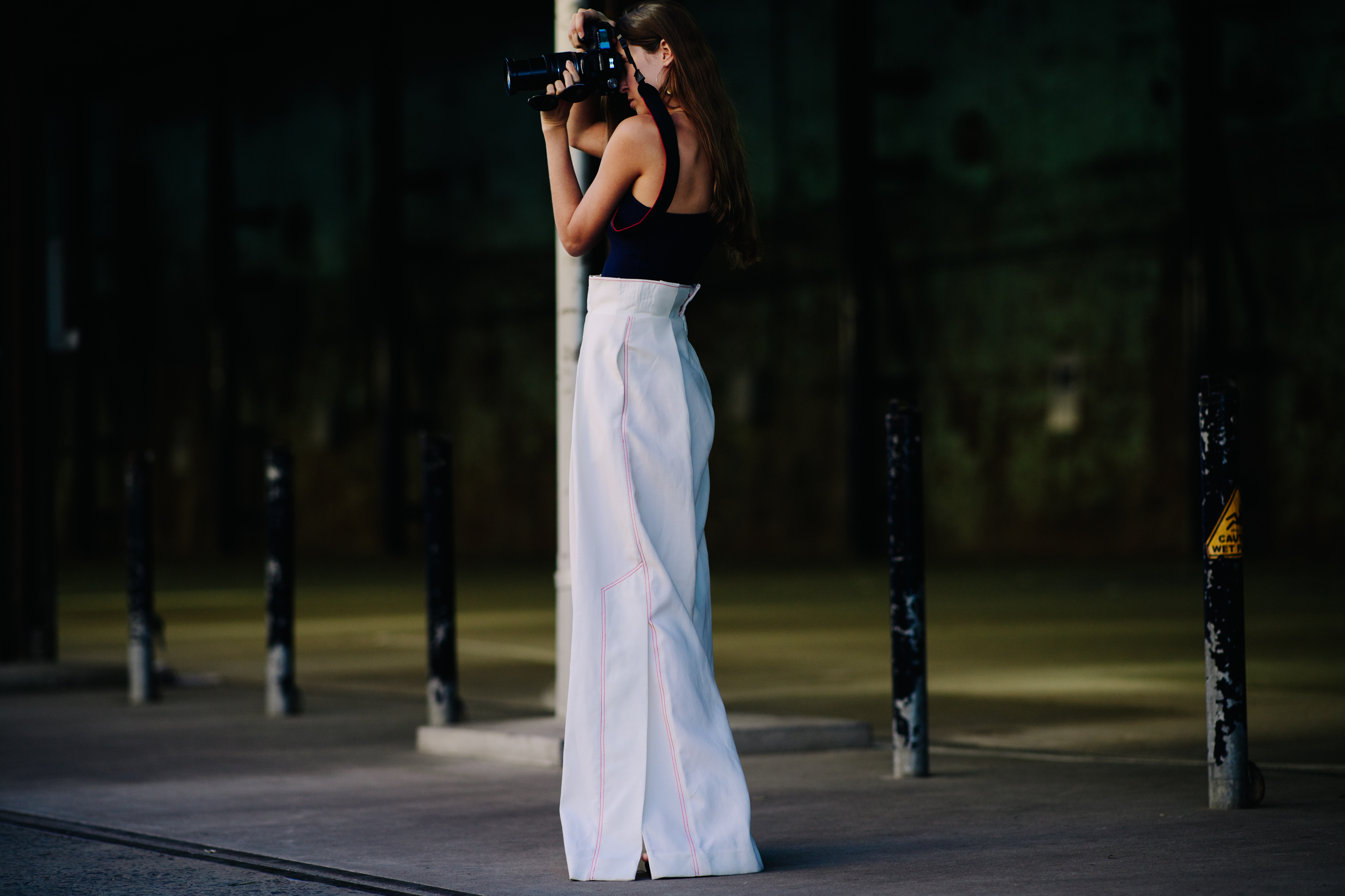 Girl wearing large white trousers