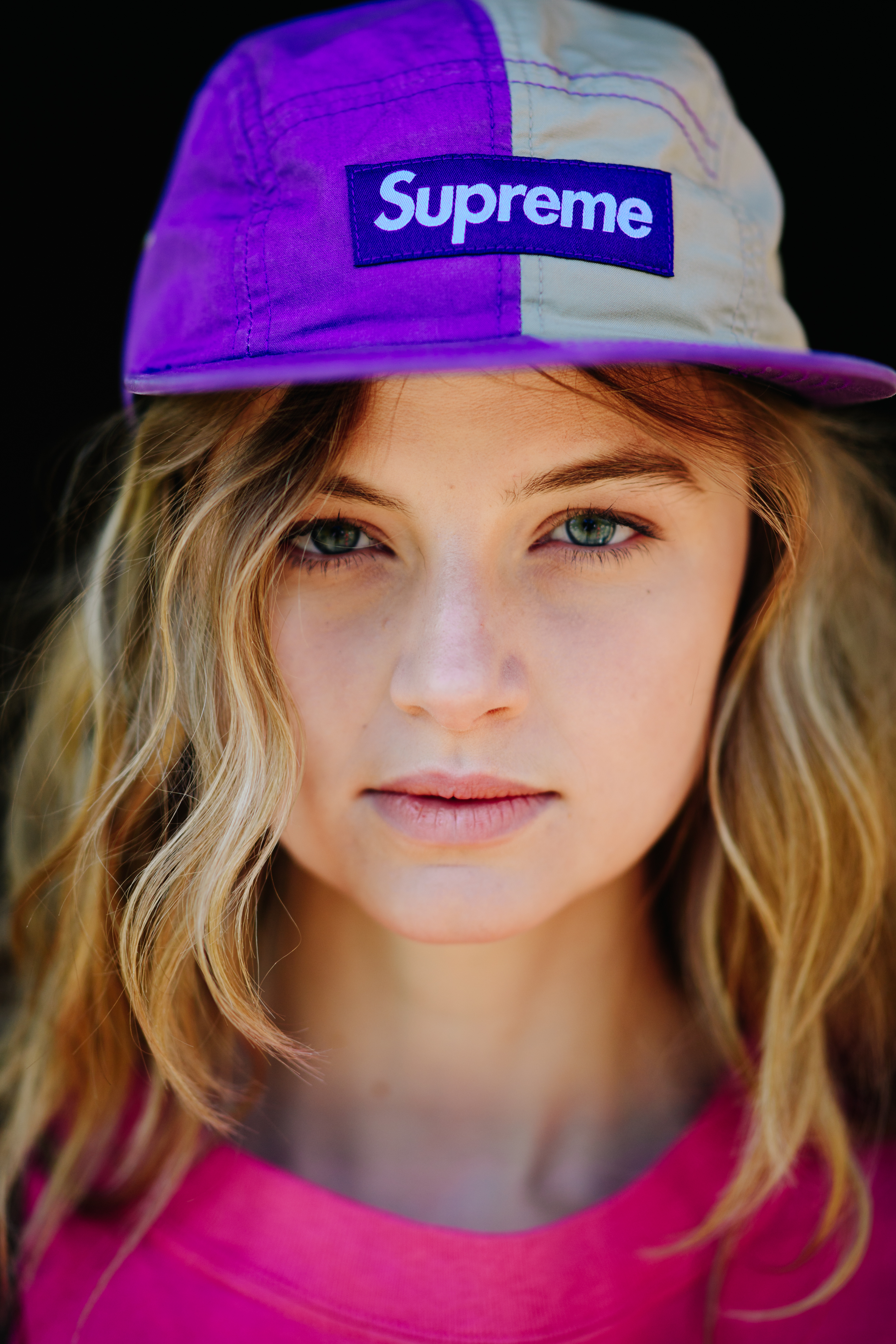 Model wearing a Supreme cap