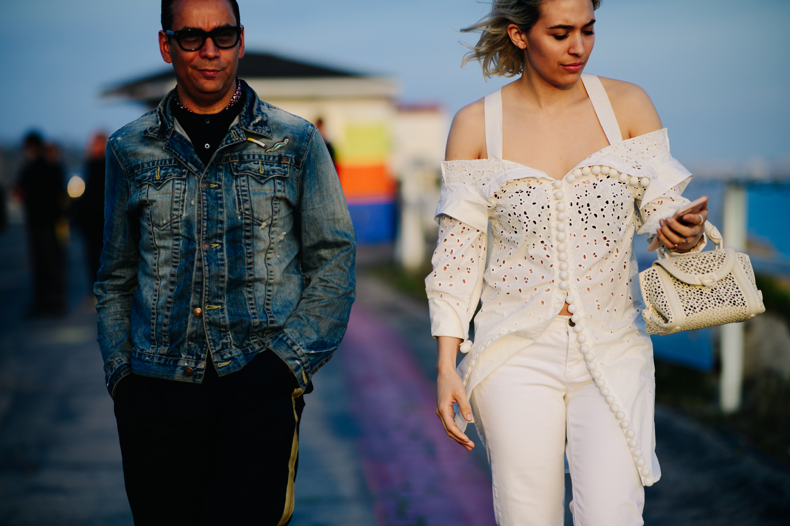 A couple wearing contrasting outfits