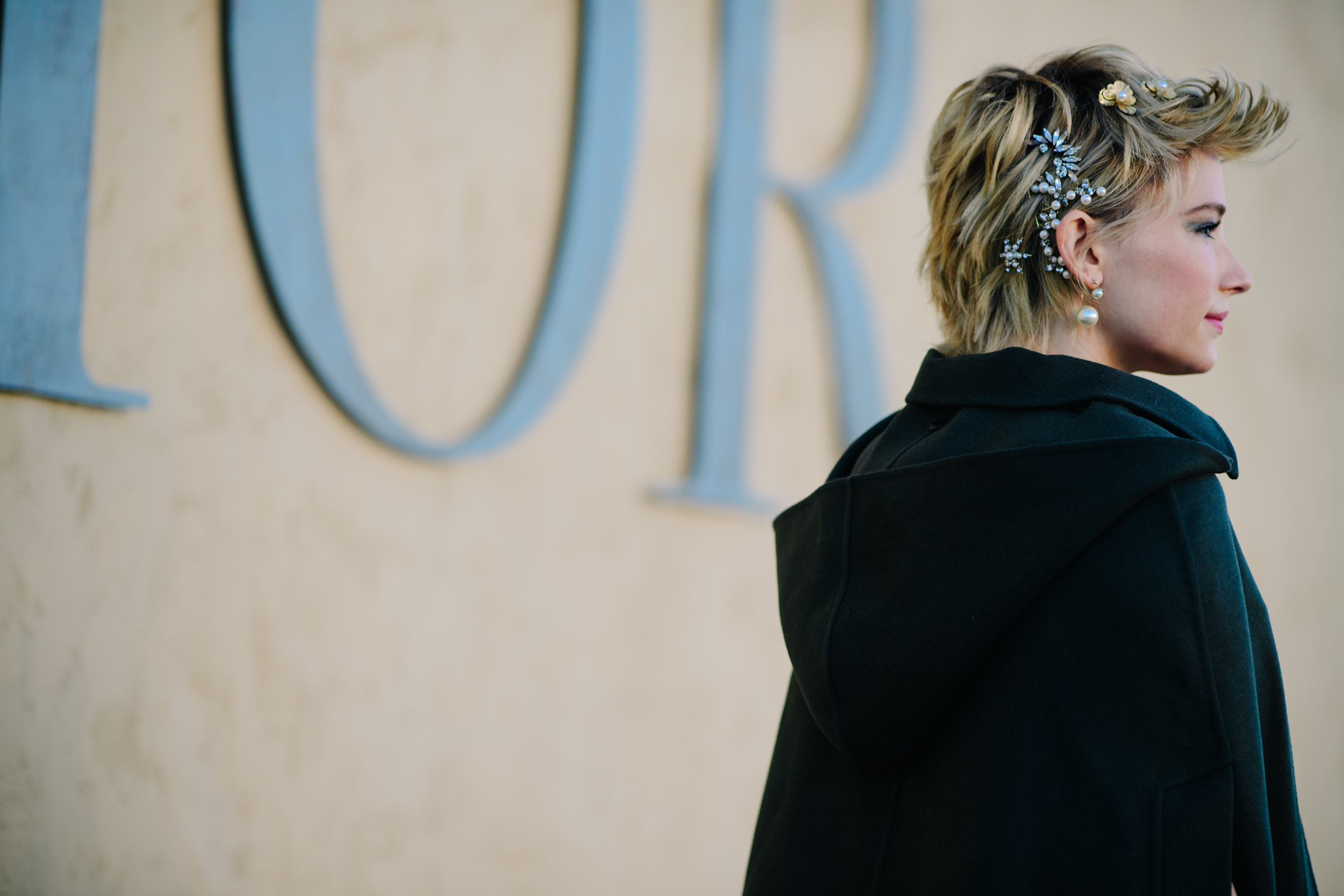 Woman wearing a black hooded coat