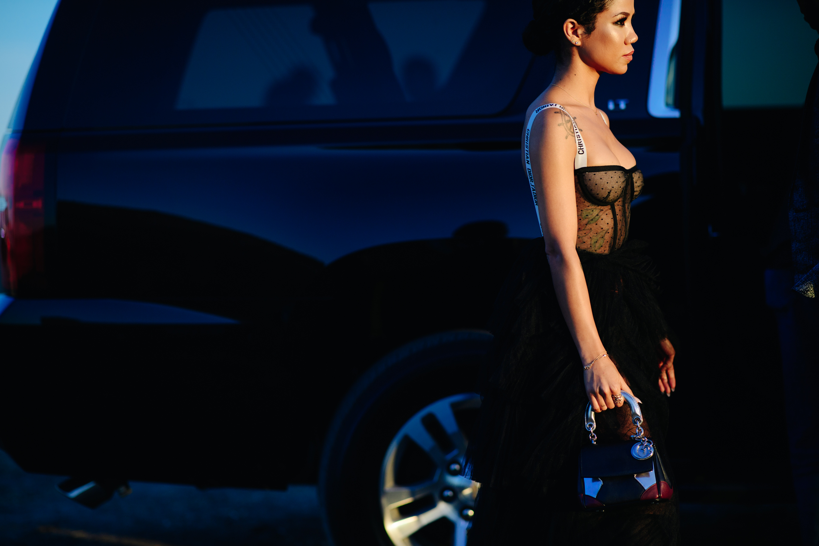 Singer wearing a transparent black dress