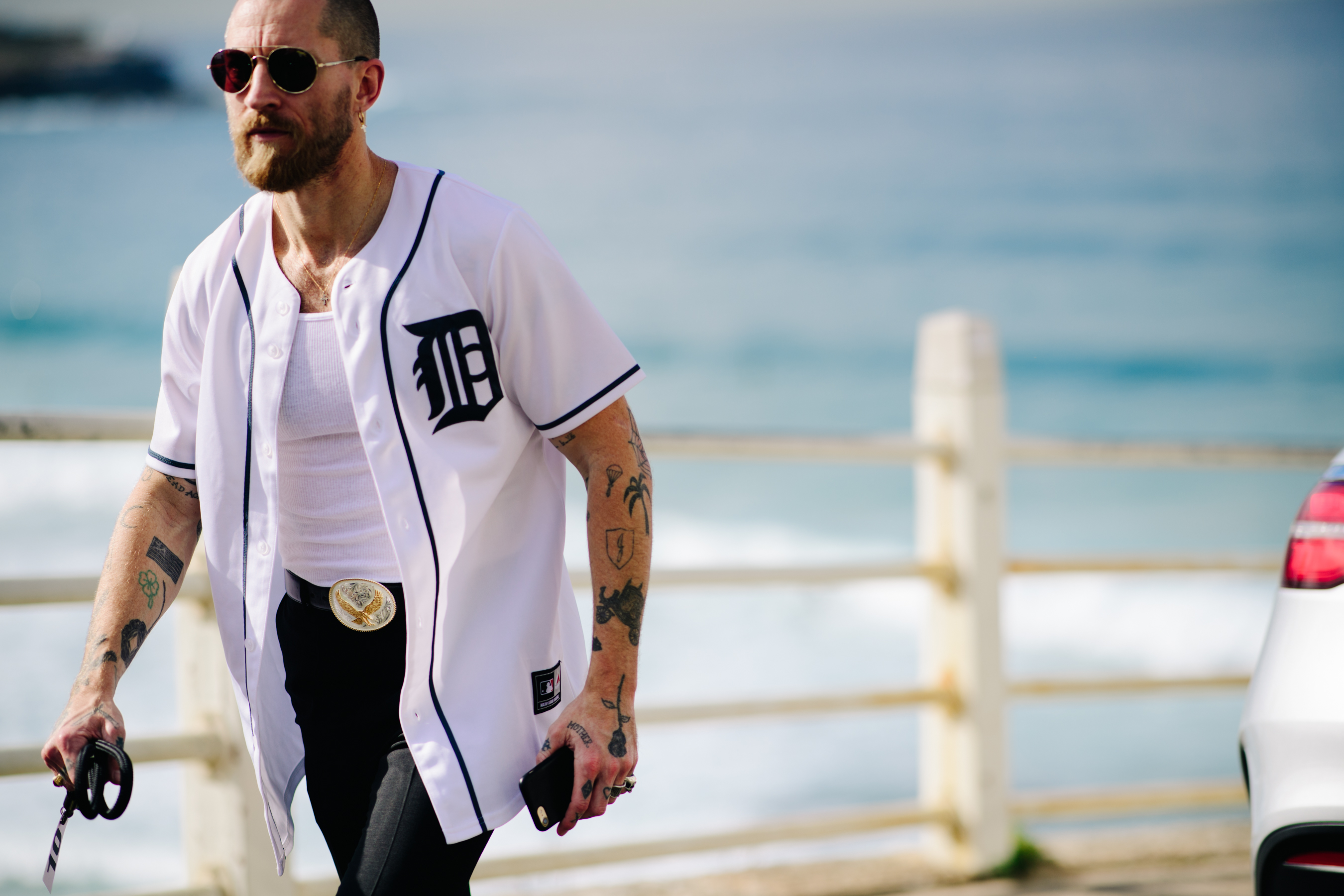 Tattooed man wearing a sports jacket