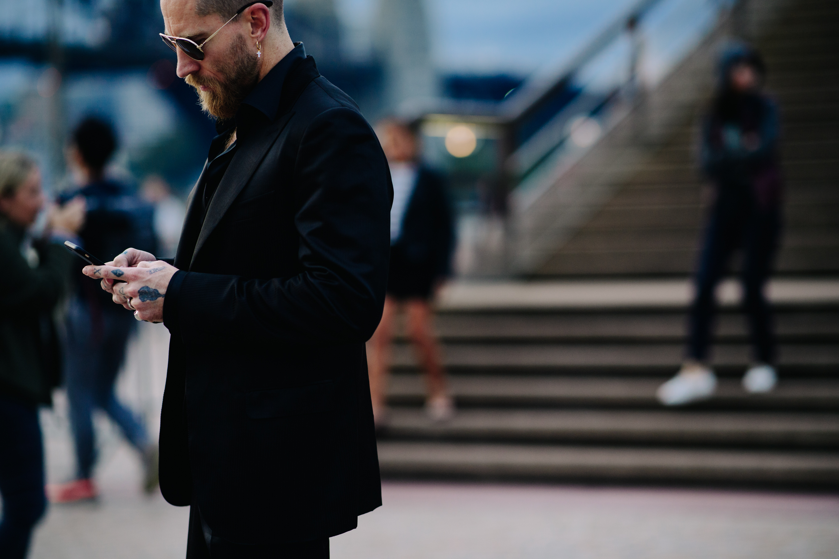 Man wearing glasses and earring