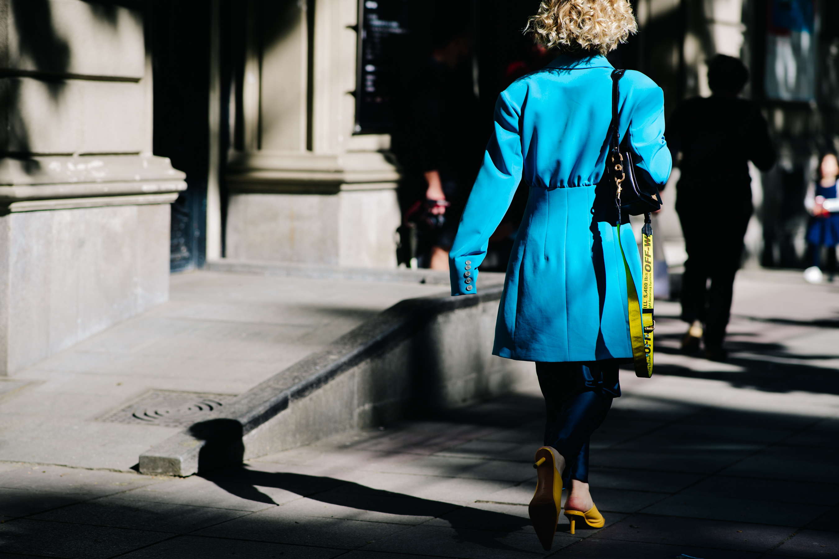 Girl carrying an Off-White clutch