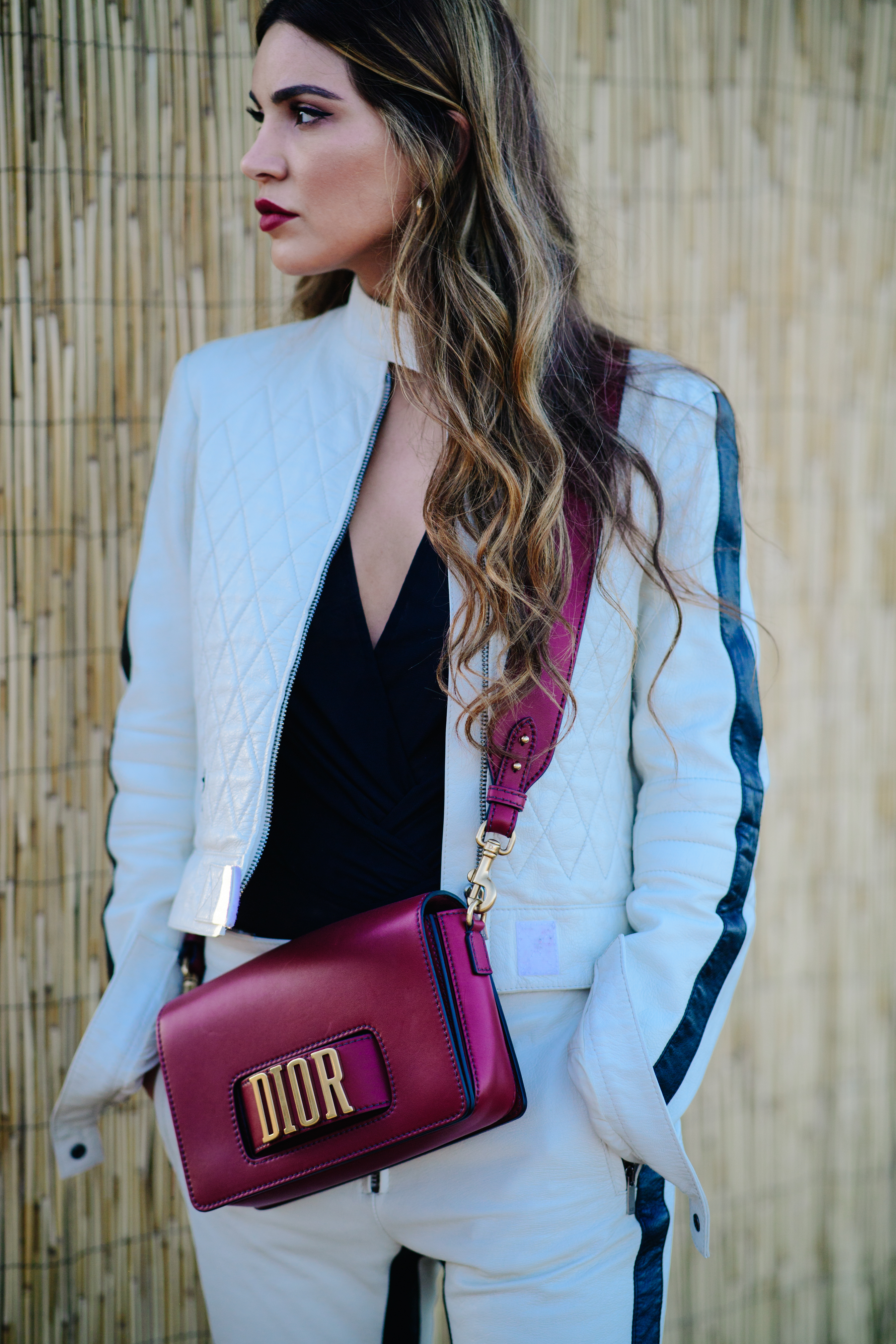 Woman wearing a leather biker suit
