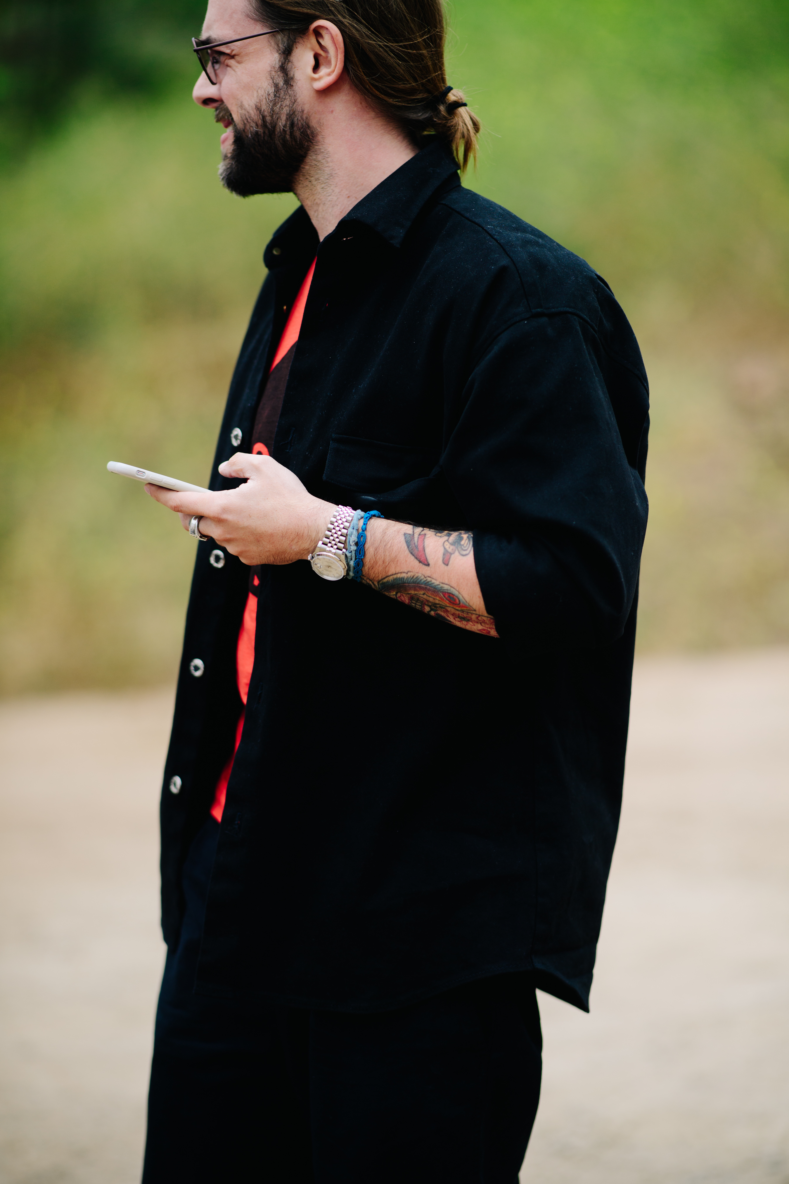 Man with tattooed arms