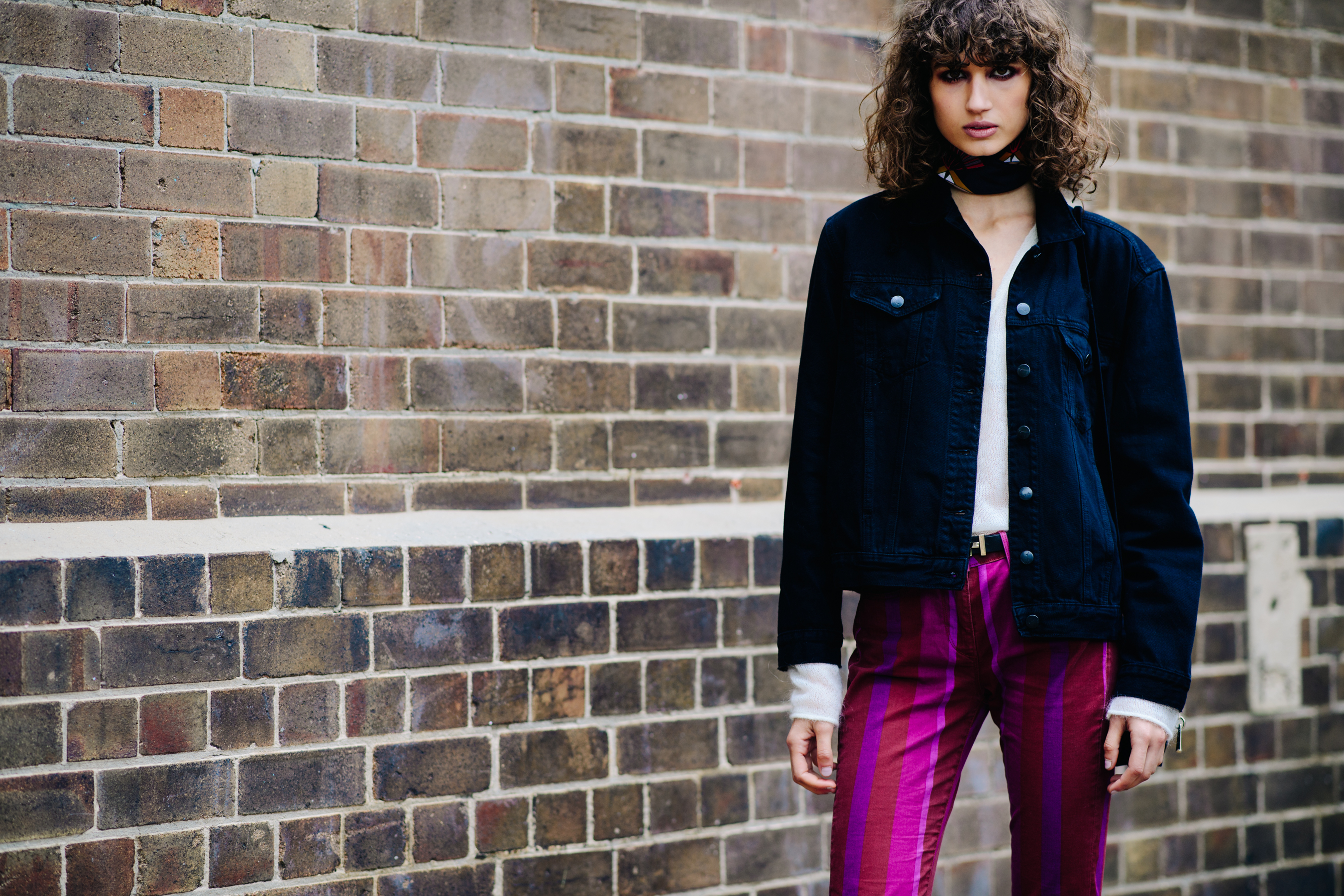 Girl wearing a black denim jacket