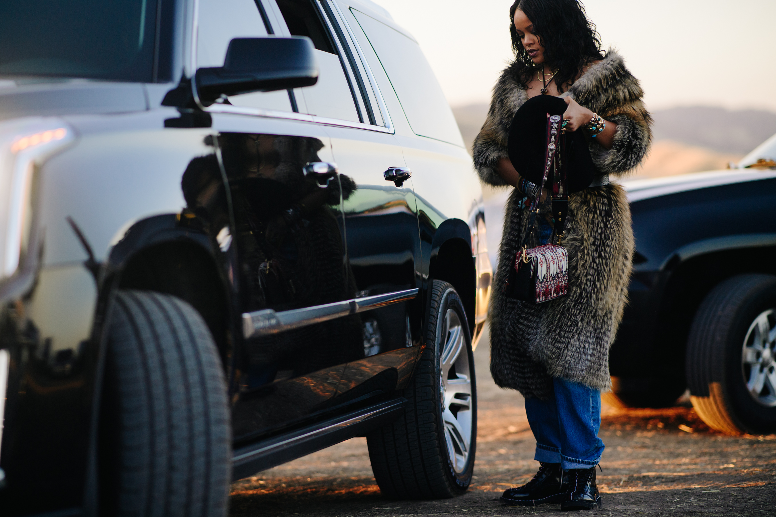 Singer wearing a long fur coat