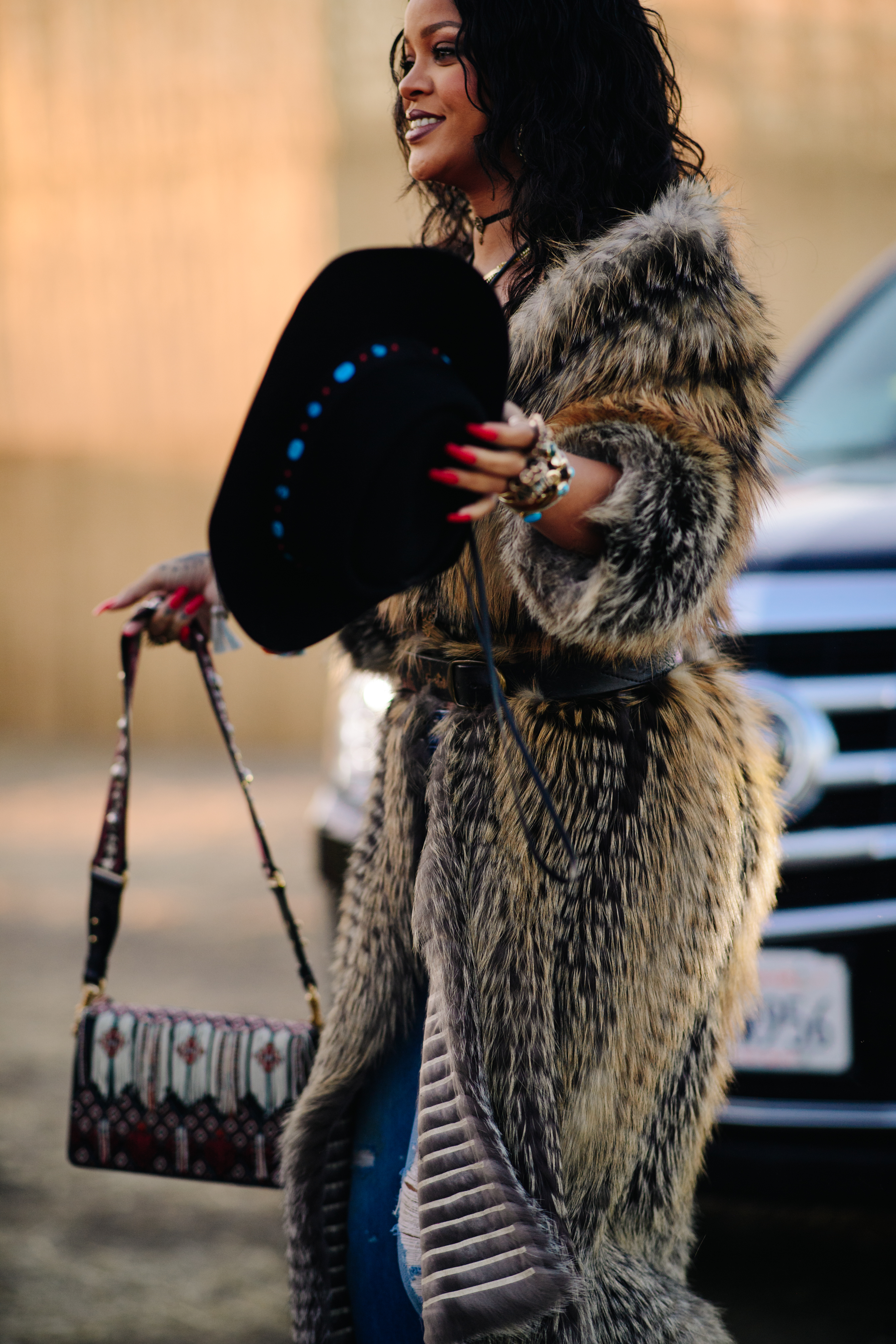 Girl wearing an oversized fur coat
