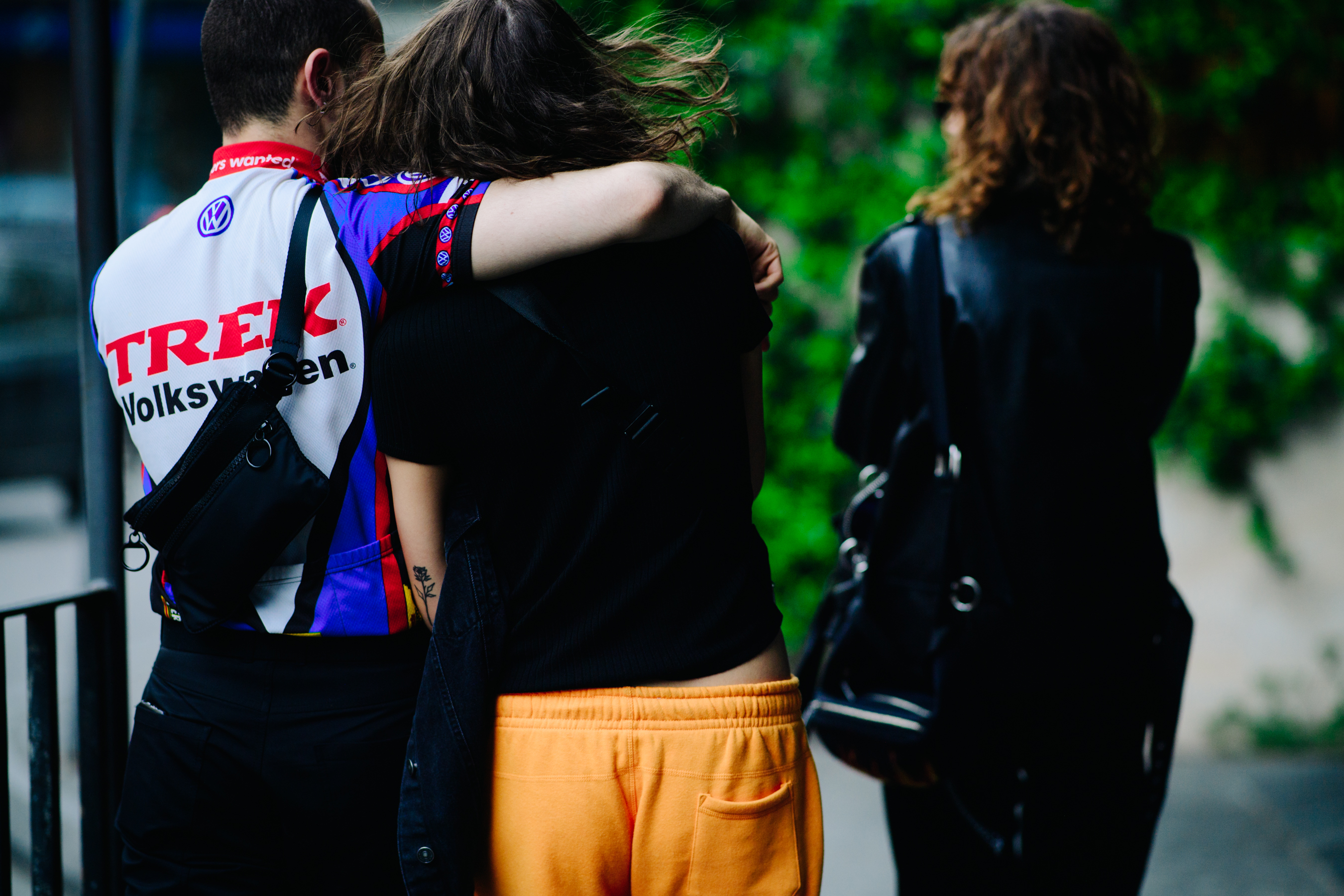 Boy hugging a tattoed girl