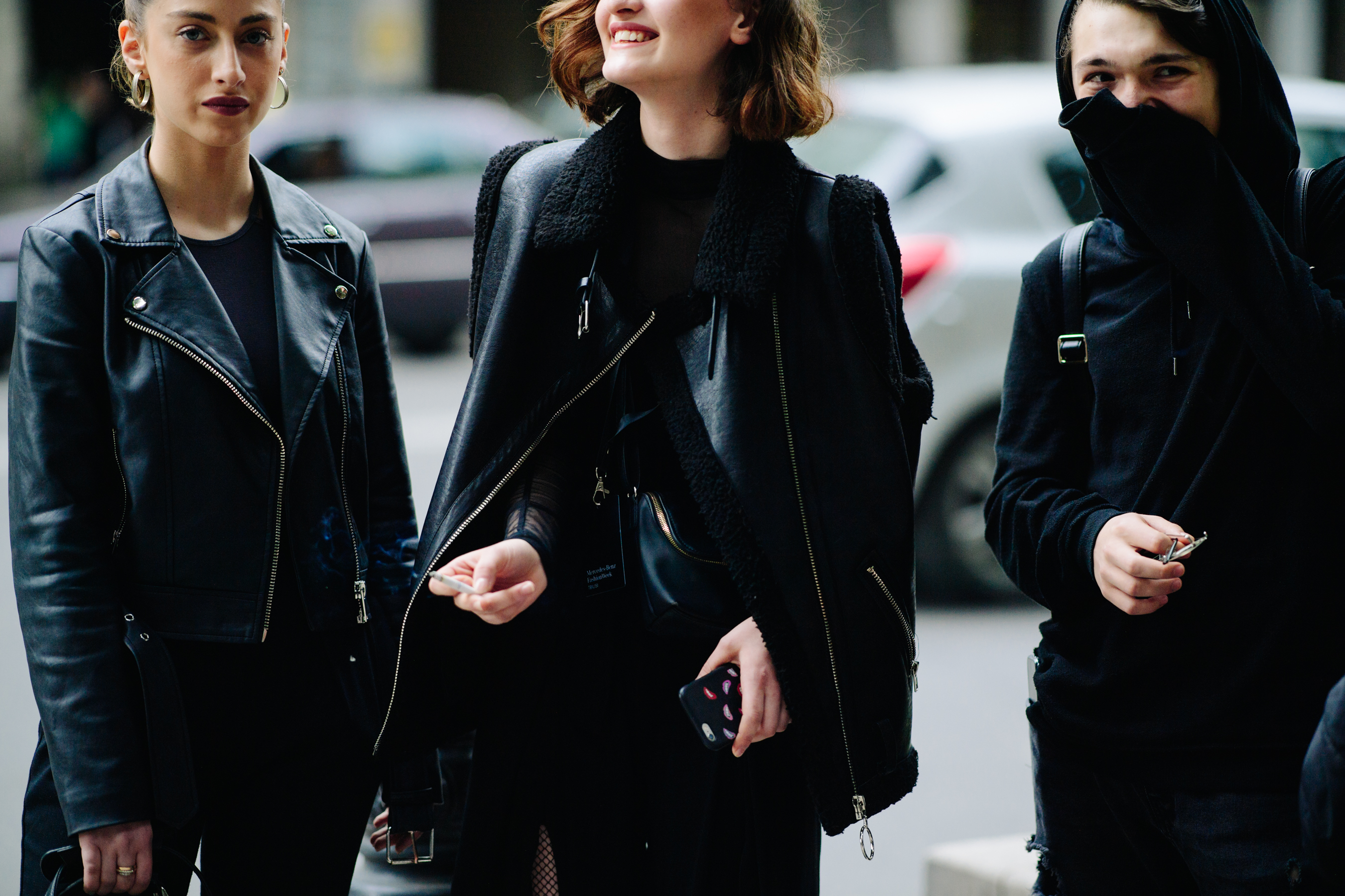 Three models wearing total black looks