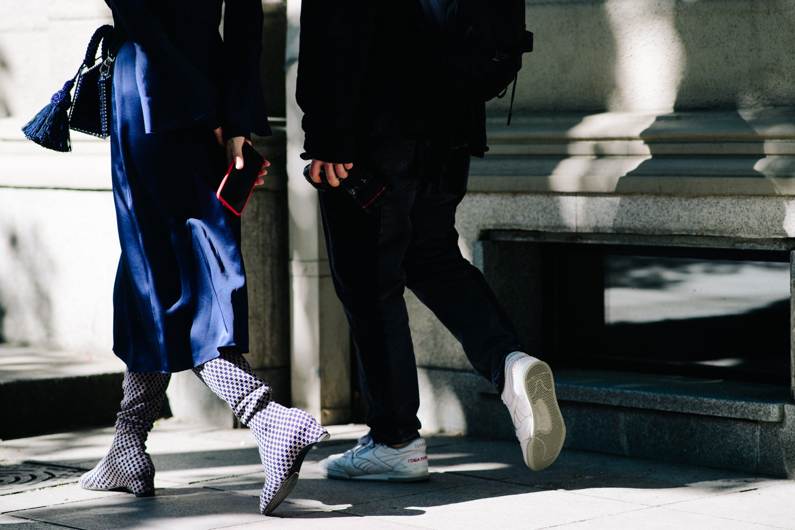 Girl and boy walking down the street