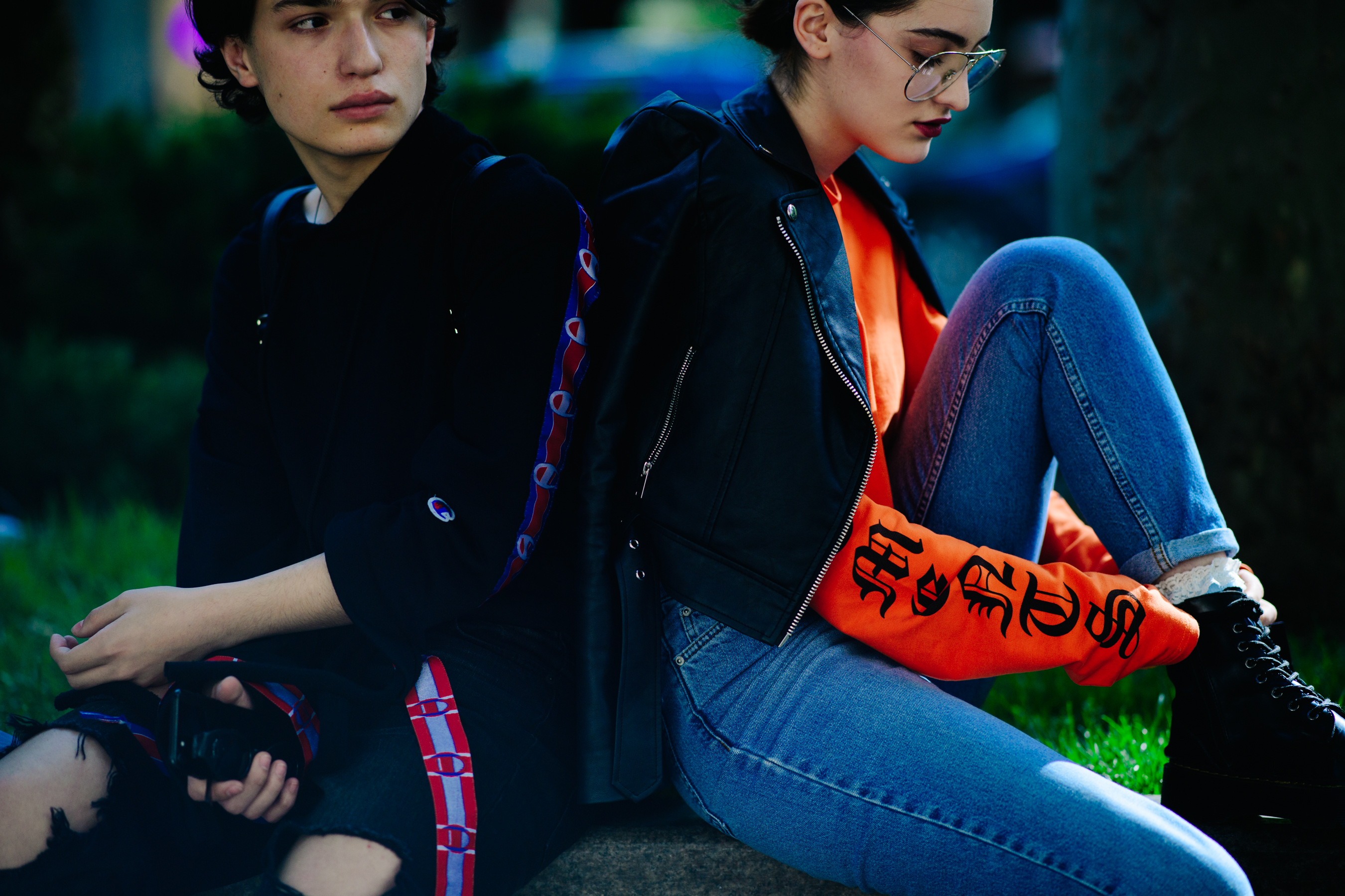 Georgian boy and girl sitting outside